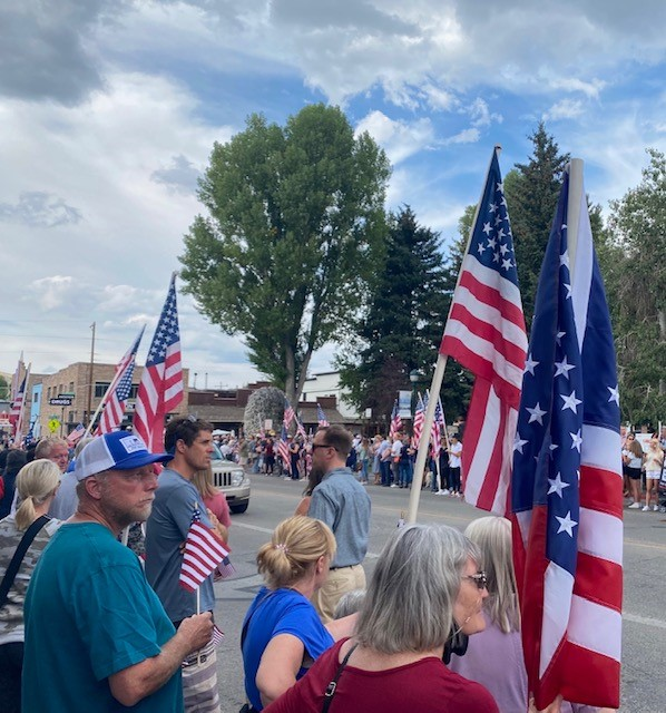 Thousands of people lined the streets on Friday waving flags, cheering and wiping tears as a motorcade carrying Lance Corporal Rylee McCollum's remainsPhoto credit: Sarah Phocas (Sarah Phocas)