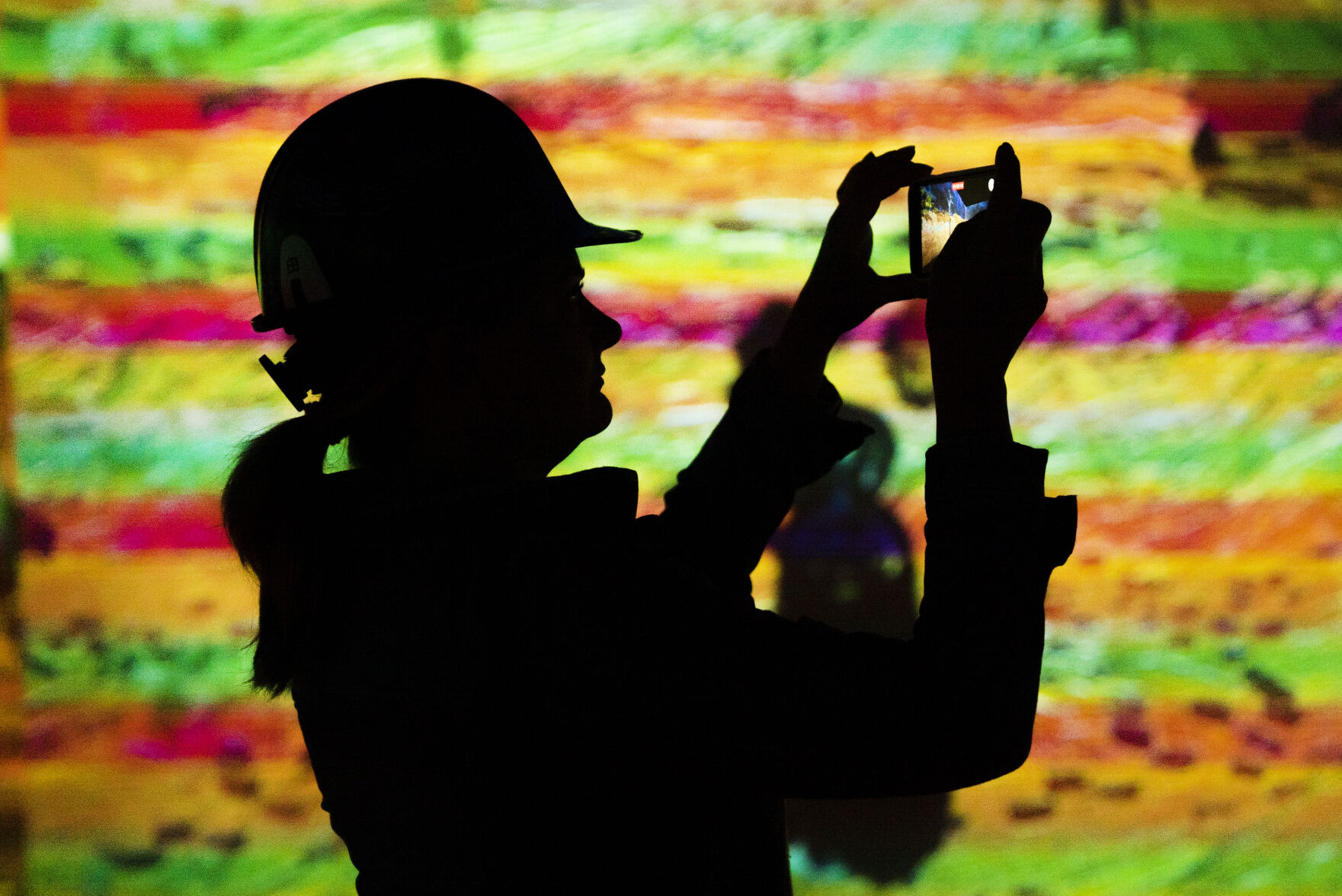 Guests experience a 10 minute example of the immersive experience during a hard hat tour of the new Immersive Van Gogh Exhibit Denver at Lighthouse Denver, just west of the River North Art District on Wednesday, September 22, 2021. (Photo by Katie Klann/Denver Gazette) (Katie Klann The Gazette)