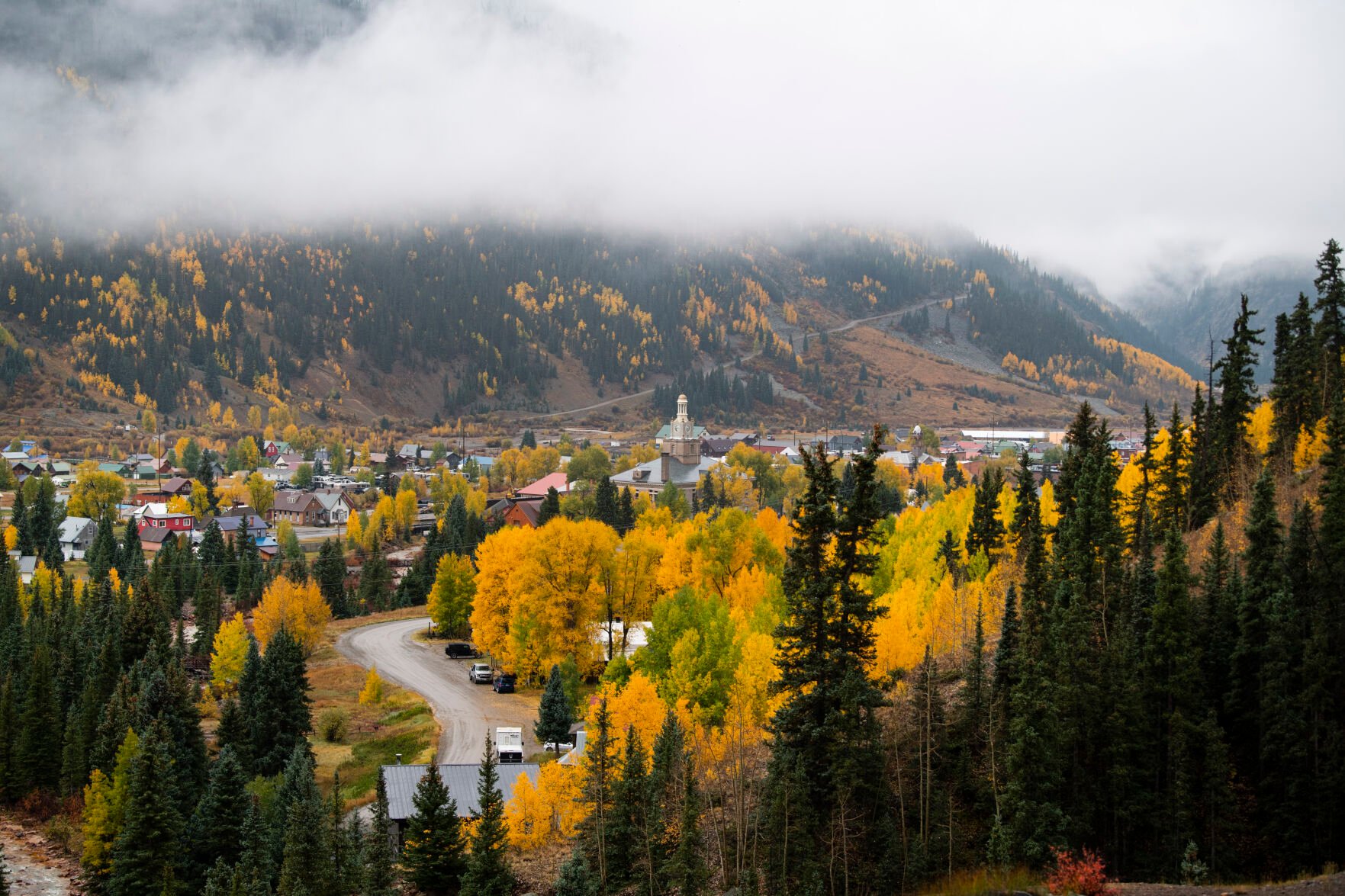 Clouds hang low over Silverton, Colo., Wednesday, Sept. 29, 2021, after a storm dropped rain and snow the historic mining down in the San Juan Mountains of southwestern Colorado. (The Gazette, Christian Murdock) (Christian Murdock/The Gazette)