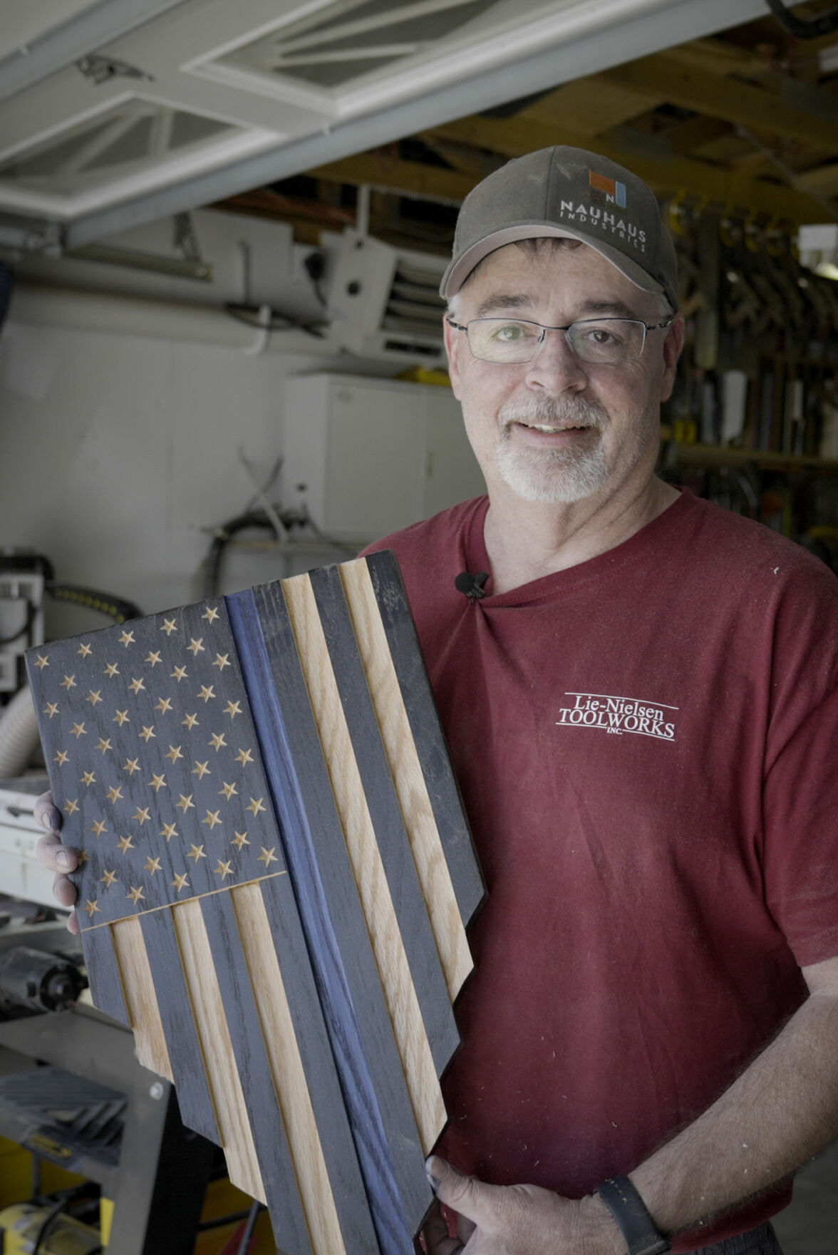 Randy Hass was saddened by the news of the Arvada shooting in June, in which Officer Gordon Beesley was fatally shot. He began making the wooden blue-line flags as a way to thank the officers in his community. (photos by Skyler Ballard, The denver Gazette)