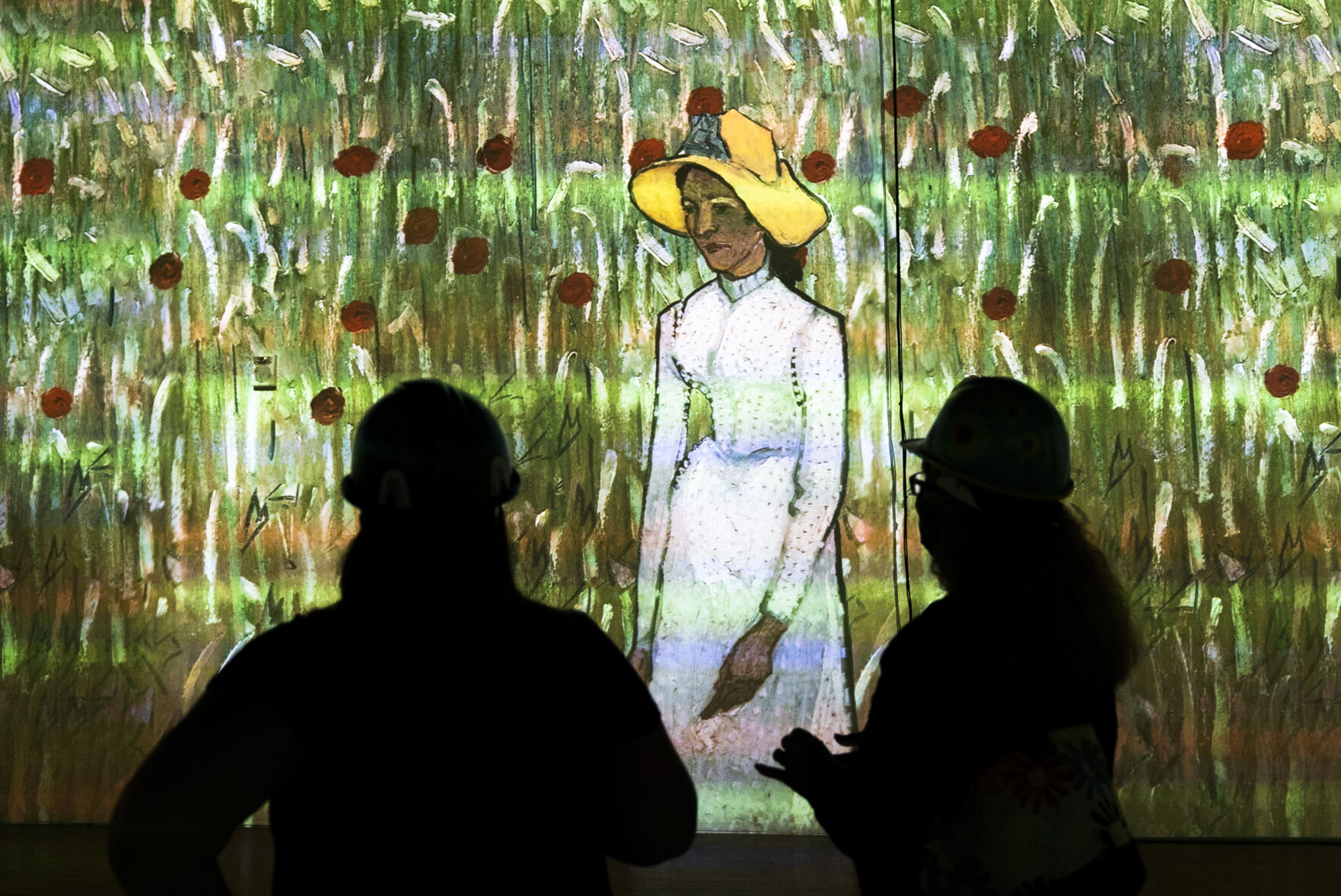 Guests experience a 10 minute example of the immersive experience during a hard hat tour of the new Immersive Van Gogh Exhibit Denver at Lighthouse Denver, just west of the River North Art District on Wednesday, September 22, 2021. (Photo by Katie Klann/Denver Gazette) (Katie Klann The Gazette)