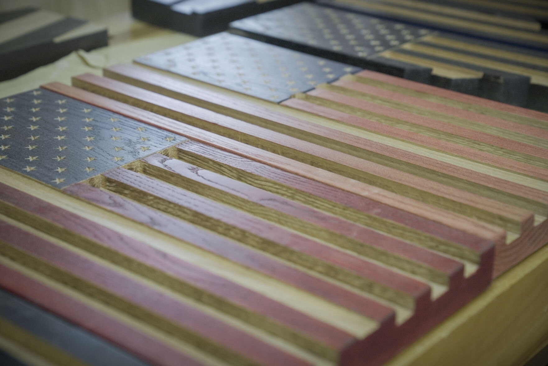 Centennial local Randy Hass began woodworking in high school and turned the passion into a career. After the Arvada shooting, he began making wooden flags to honor police officers as a way of giving back. (Skyler Ballard, The DENVER Gazette)