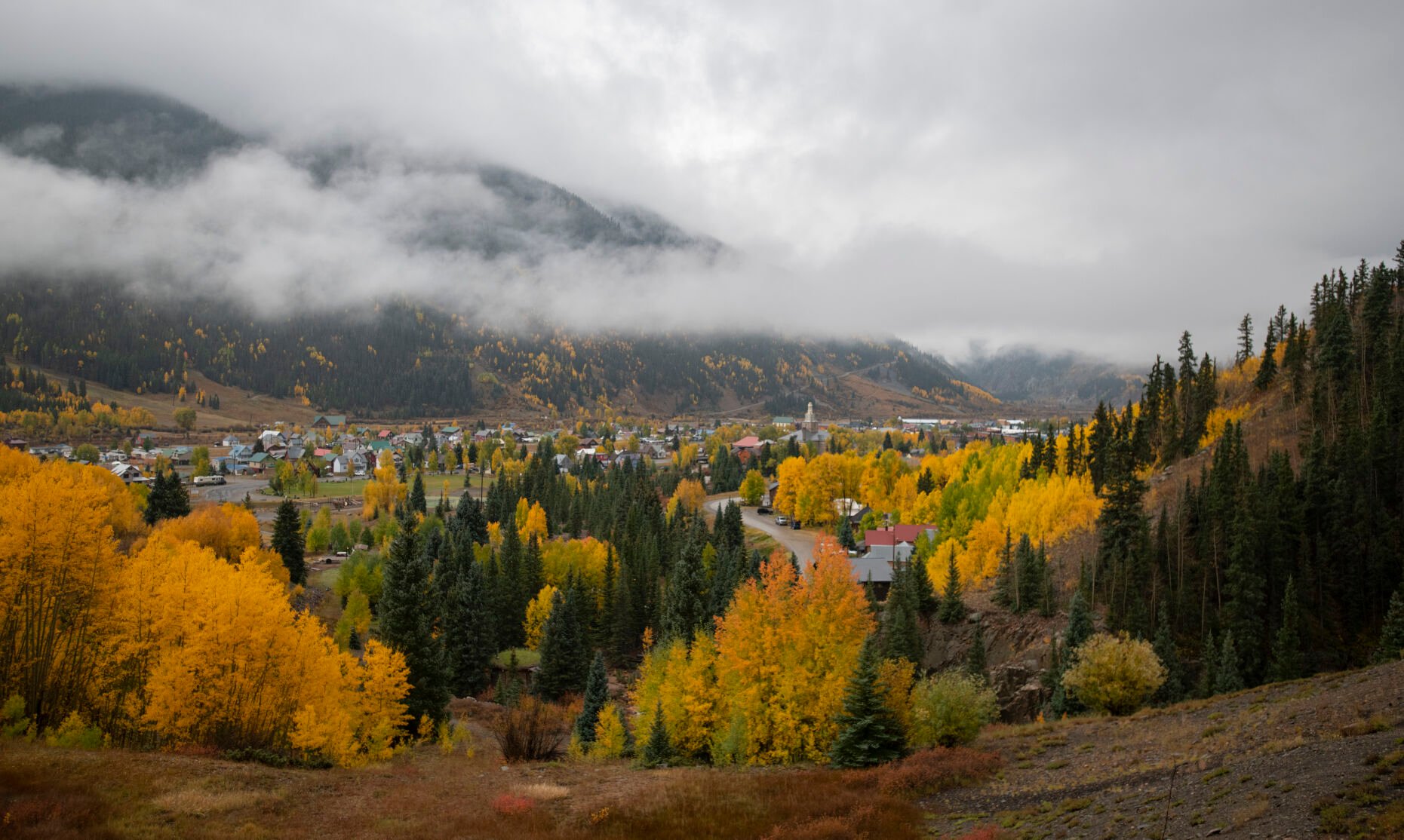 Clouds hang low over Silverton, Colo., Wednesday, Sept. 29, 2021, after a storm dropped rain and snow the historic mining down in the San Juan Mountains of southwestern Colorado. (The Gazette, Christian Murdock) (Christian Murdock/The Gazette)