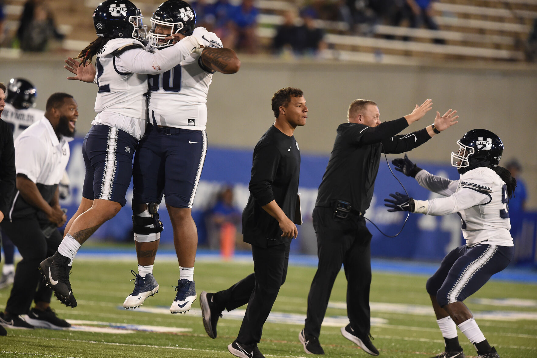 The Utah St. team and coaches celebrate after Air Force goes for it on 4 and 2 and is stopped by the Utah St. defense in the third quarter of a game at Falcon Stadium in Colorado Springs, Colorado on Saturday, Sept. 18, 2021. (Photo by Jerilee Bennett, The Gazette) (JERILEE BENNETT, THE GAZETTE)