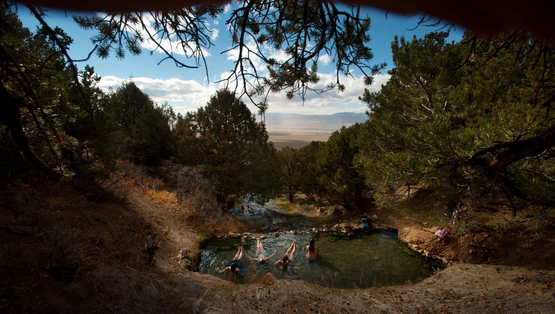 Patrons soak in one of the “Top Ponds” at Valley View Hot Springs in the San Luis Valley. Photo by Mark Reis, The Gazette (Valley View Hot Springs. Mark Reis</p><p>MARK REIS, THE GAZETTE)” /><figcaption class=