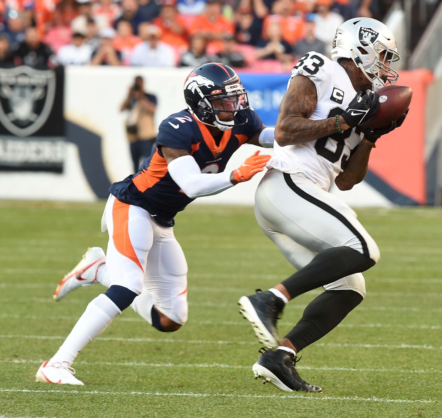 Broncos cornerback Pat Surtain defends Raiders tight end Darren Waller at Empower Field at Mile High Stadium on Sunday, Oct. 17, 2021. The Broncos were defeated 34-24. (Photo by Jerilee Bennett, The Gazette)