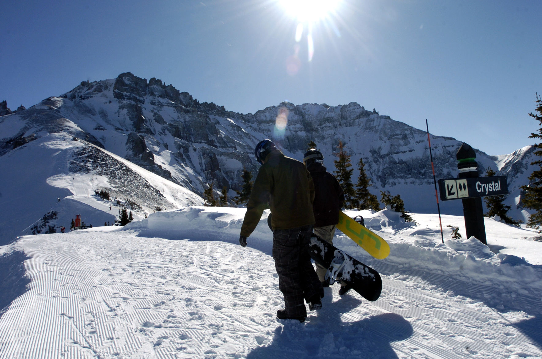 Snowboarders hike the ridge from Chair 12 to the top of the Black Iron Bowl with Palmyra Peak in the background at the Telluride Ski Resort. Christian Murdock, The Gazette (murdock)