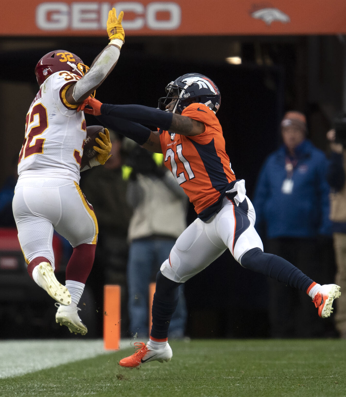 Washington Football Team running back Jaret Patterson (32) is pushed out of bound by Denver Broncos cornerback Ronald Darby (21) after a first down (32) during the third quarter Sunday, Oct. 31, 2021, at Empower Field at Mile High in Denver. Denver won 17-10.(The Gazette, Christian Murdock) (Christian Murdock/The Gazette)