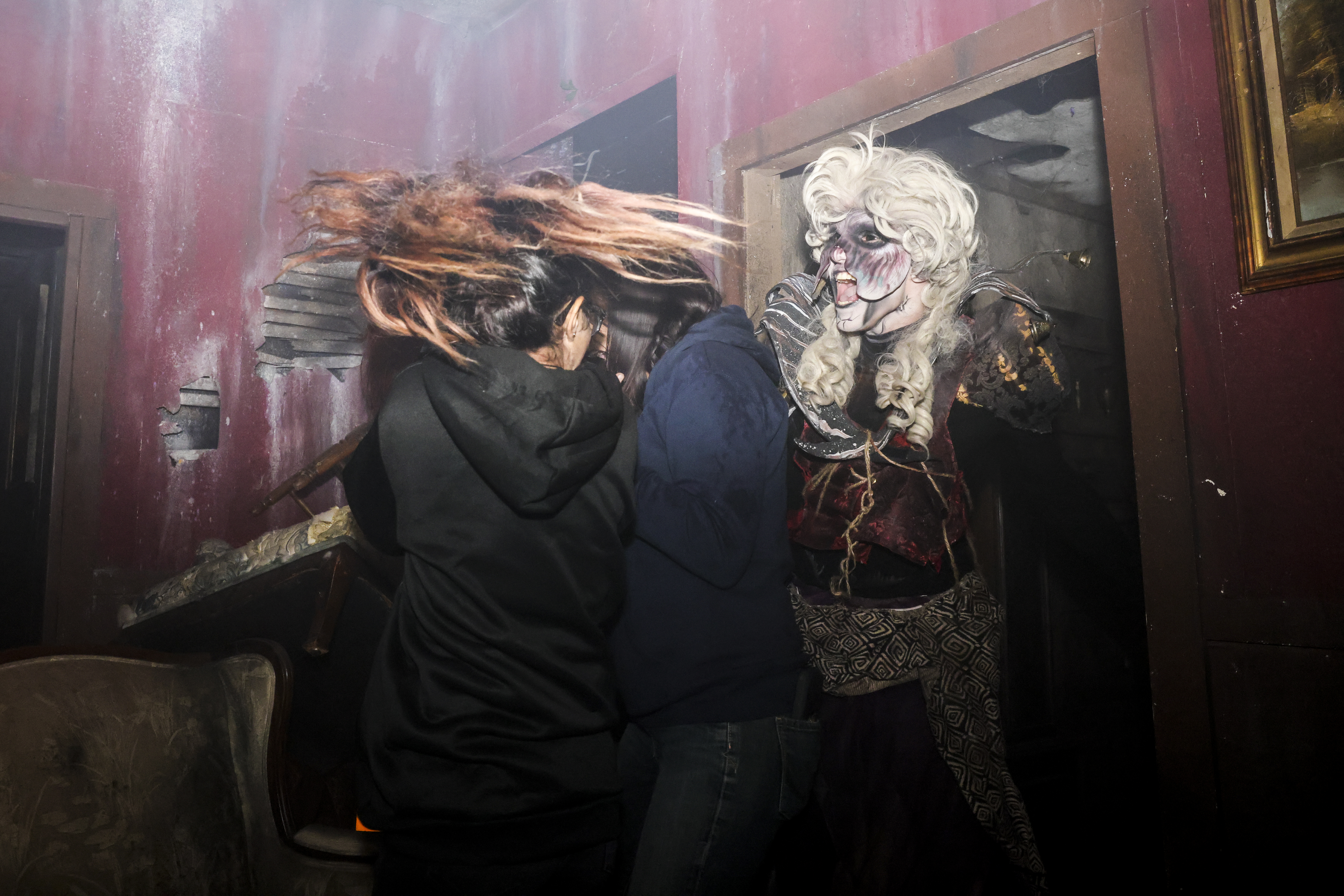 A 13th Floor Haunted House performer scares guests at the haunted house on Tuesday, Oct. 12, 2021 in Denver. (Michael Ciaglo/Special to The Denver Gazette)