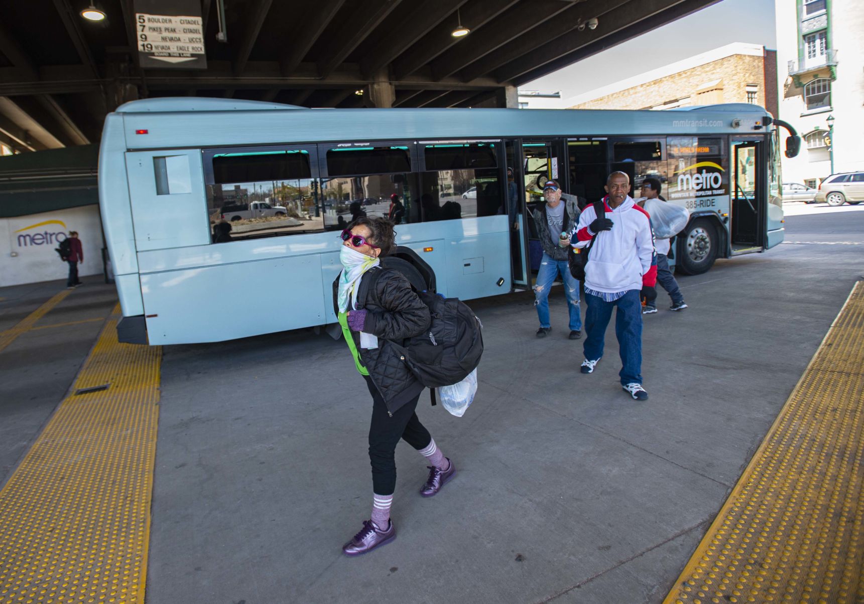 Passengers exit the Route 11 bus of Mountain Metro Transit Monday, April 6, 2020, at the downtown Colorado Springs terminal. Mountain Metro cut service in mid-September because of a driver shortage and has no timeline for restoration of services. (The Gazette, Christian Murdock) (CHRISTIAN MURDOCK/THE GAZETTE)