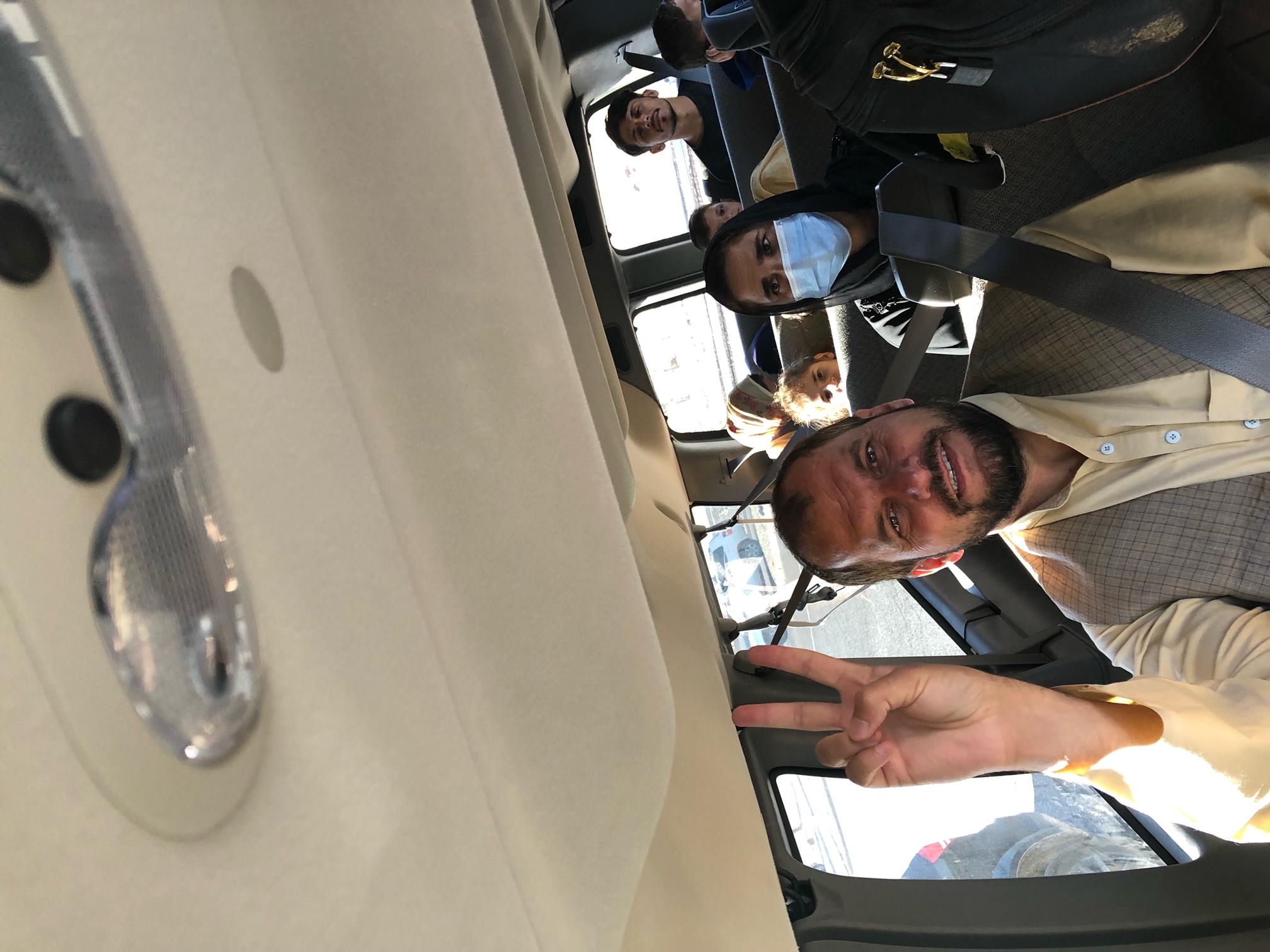 Matt and family board a 15-person van headed across the New Mexico desert for El Paso airport on the way to Denver Thursday. (Chris Liggett)