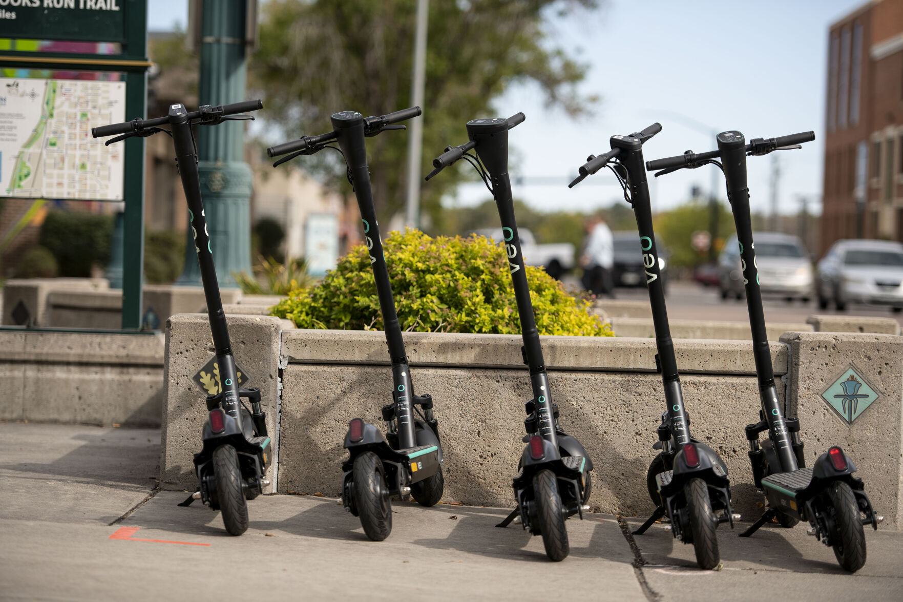 Veo electric scooters at the corner of Bijou Street and Nevada Avenue by Acacia Park. (Chancey Bush, the gazette)
