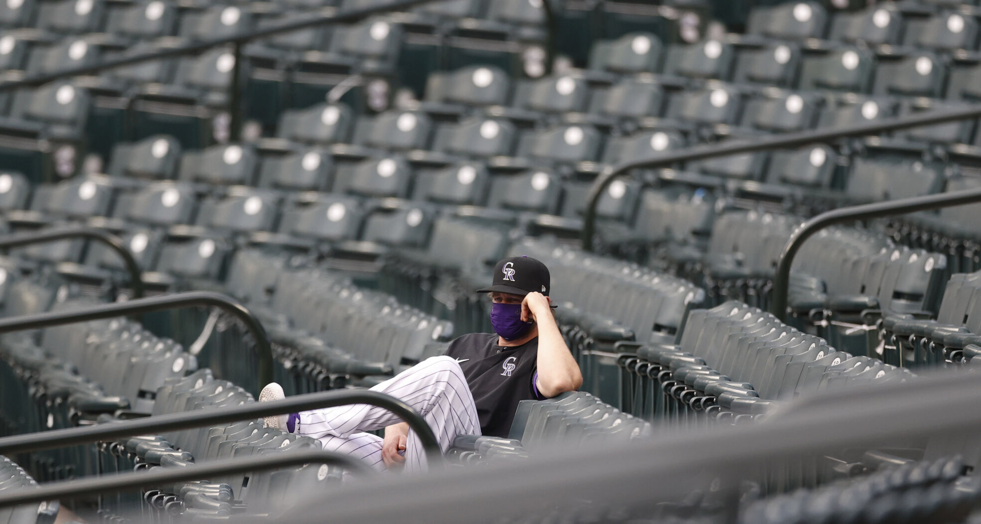 Colorado Rockies relief pitcher Scott Oberg looks on from the right-field stands in the first inning of a baseball game against the San Diego Padres Friday, July 31, 2020, in Denver. (AP Photo/David Zalubowski) (David Zalubowski)