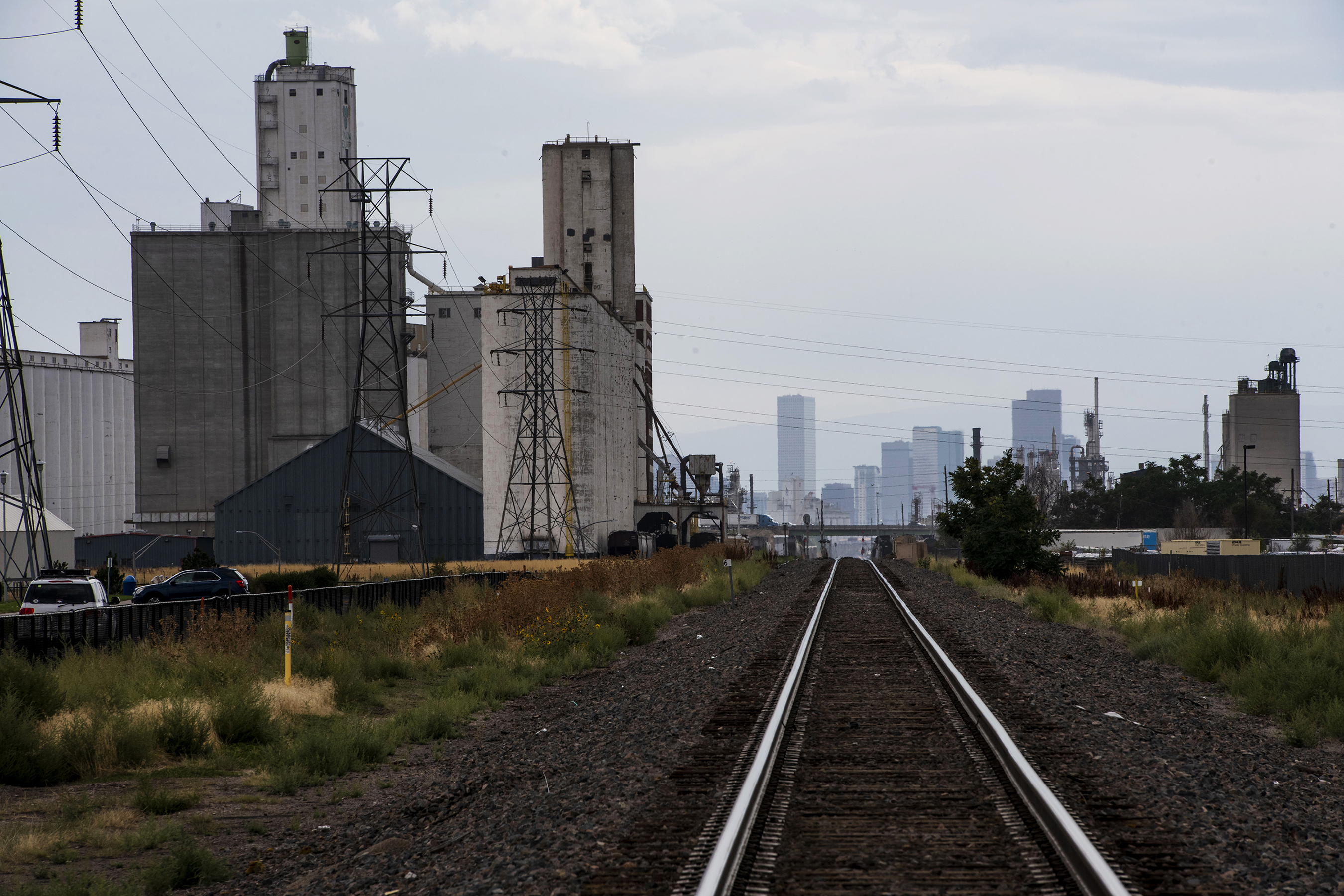 View of the Denver skyline from Commerce City in Adams County on August 26, 2021. (Chancey Bush/ The Denver Gazette)