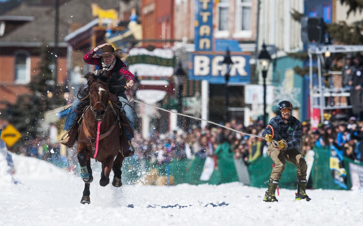 Krista Halsnes on her horse Rango haulas Tanner Coulter down the race course at the 70th annual Leadville Skijoring competition on Saturday, March 3, 2018. (Gazette file)