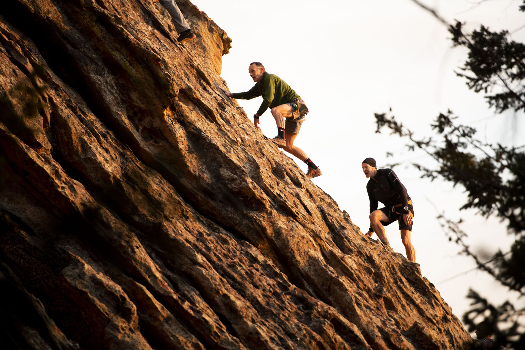 Bill Wright, founder of the Satan’s Minions Scrambling Club, right, scales a slab of rock with the group near the Flatirons of Boulder. “It is unique,” Wright says of the group. “And it’s unique because the Flatirons are unique.” (Chancey Bush, The Gazette)