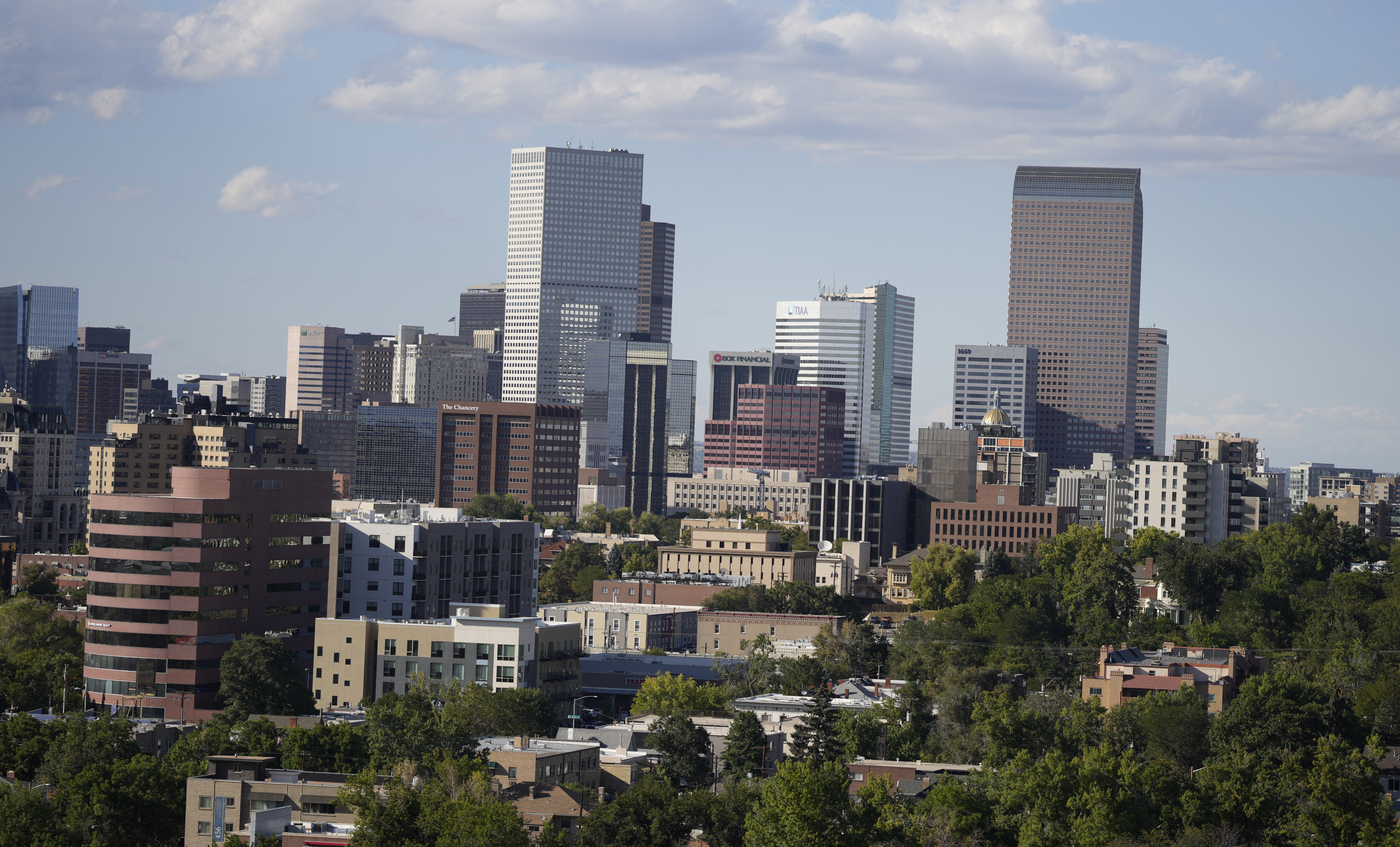 Photo description: Clouds hang over the skyline of downtown Monday, Sept. 20, 2021, in Denver. (David Zalubowski, The Associated Press)