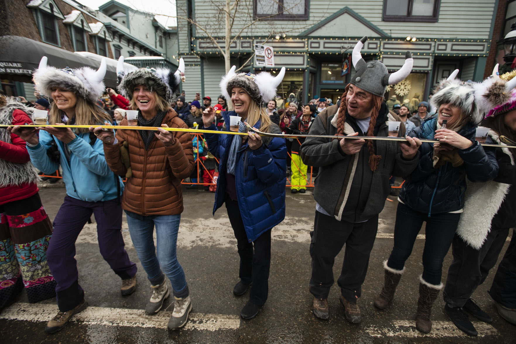 Mindy Armstrong, left, Bonnie Paffenroth, Laura Welsh-Smith, John Daisy and Cathy Carleton waits for the start of the ski shot event at the Ullr Fest in Breckenridge. (Photo by Kelsey Brunner/The Gazette)
