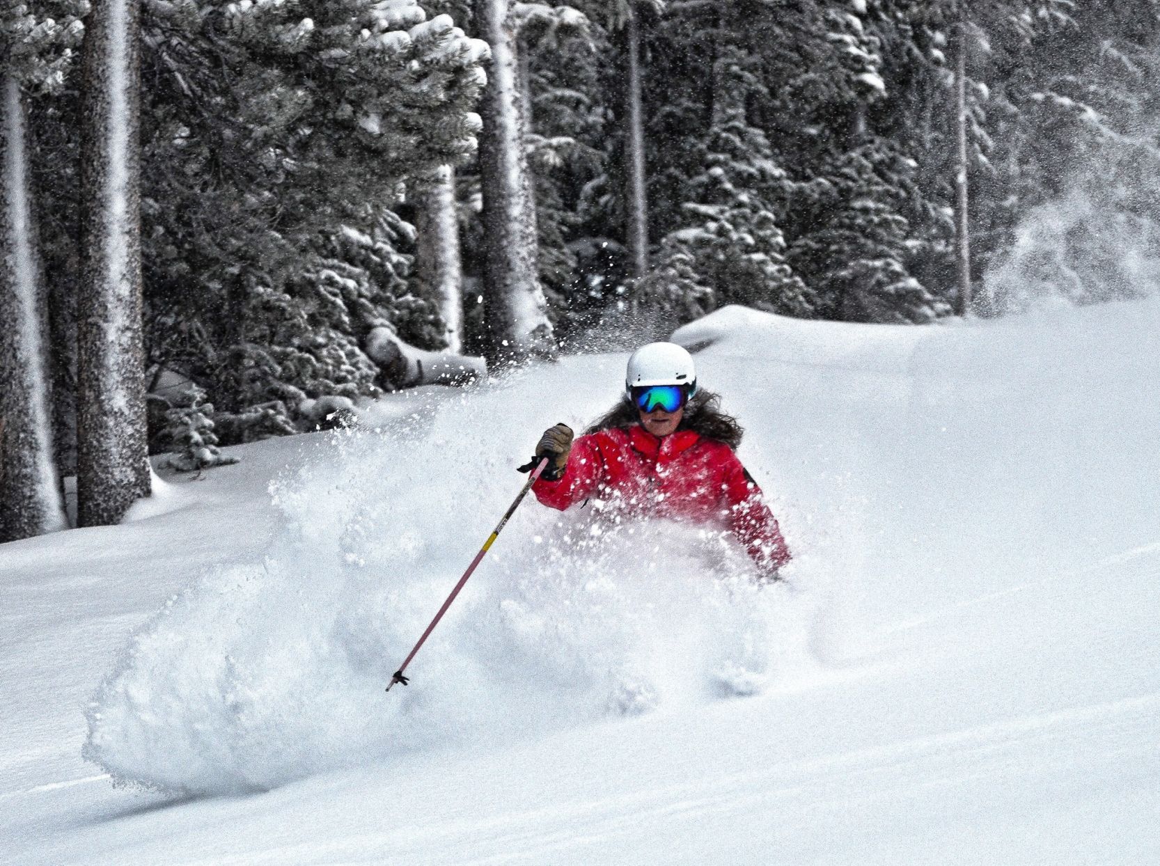 Natalie Newberry plows through powder at her home Winter Park Resort. The ski patroller recommends getting to the resort’s Mary Jane side early for fresh stashes. Photo courtesy Natalie Newberry