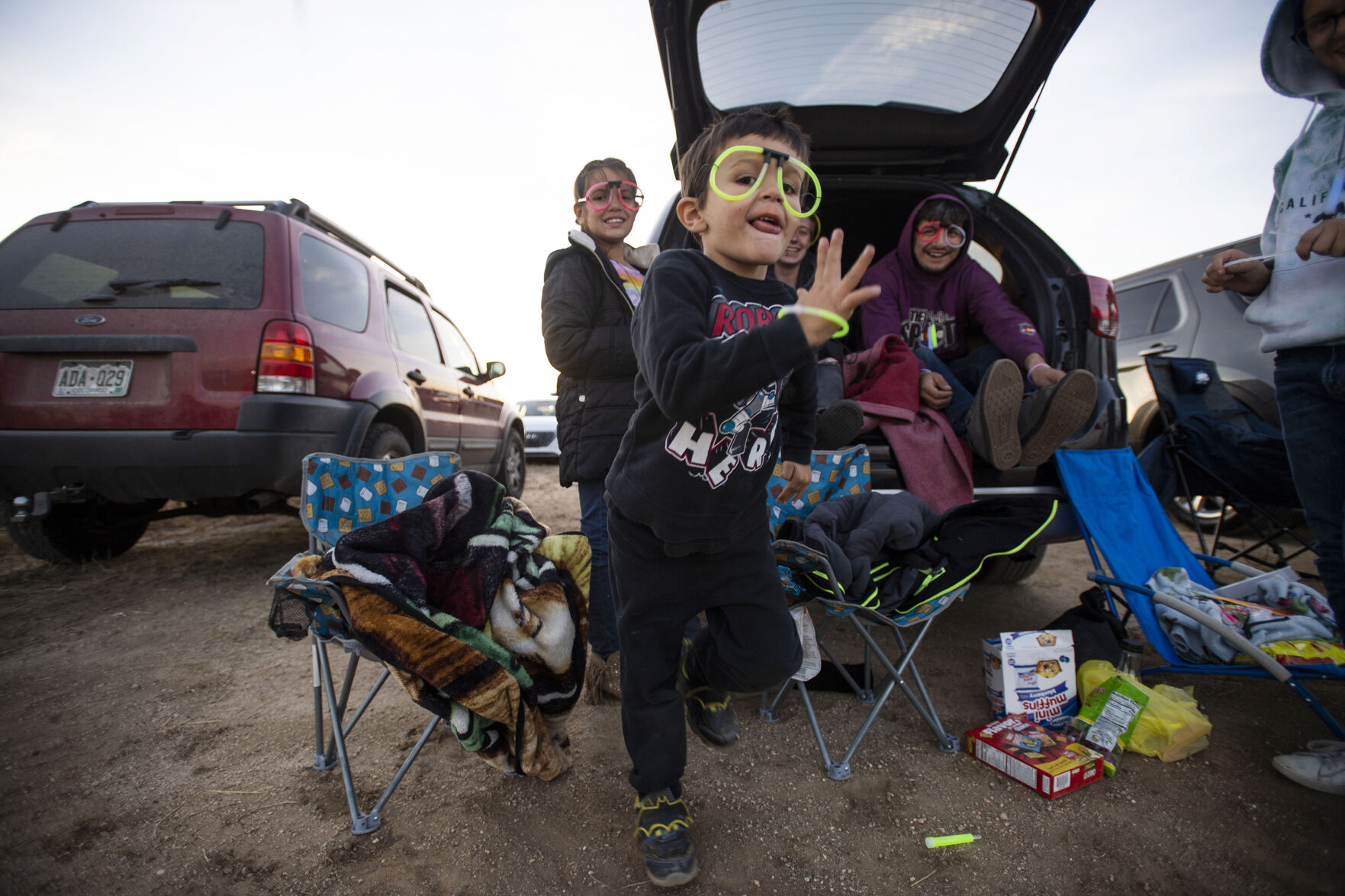 People tailgate before the start of the Cabin Fever Laser Show at the El Paso County Fairgrounds in Calhan, Colo., on Friday, Oct. 22, 2021. The drive-in laser light show was started during the COVID-19 pandemic, offering a unique socially distance entertainment experience. The show includes 25 high-powered lasers and DUAL large screen Laser projection. The last show is Sunday at 7:30pm. (Chancey Bush / The Gazette) (Chancey Bush/ The Gazette)