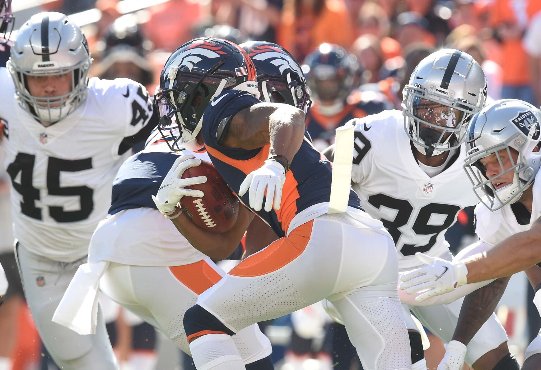 Broncos wide receiver Diontae Spencer carries the ball past some Raiders. The Broncos lost to the Raiders 34-24 on Sunday, Oct. 17, 2021 at Empower Field at Mile High Stadium. (Photo by Jerilee Bennett, The Gazette) (Jerilee Bennett)