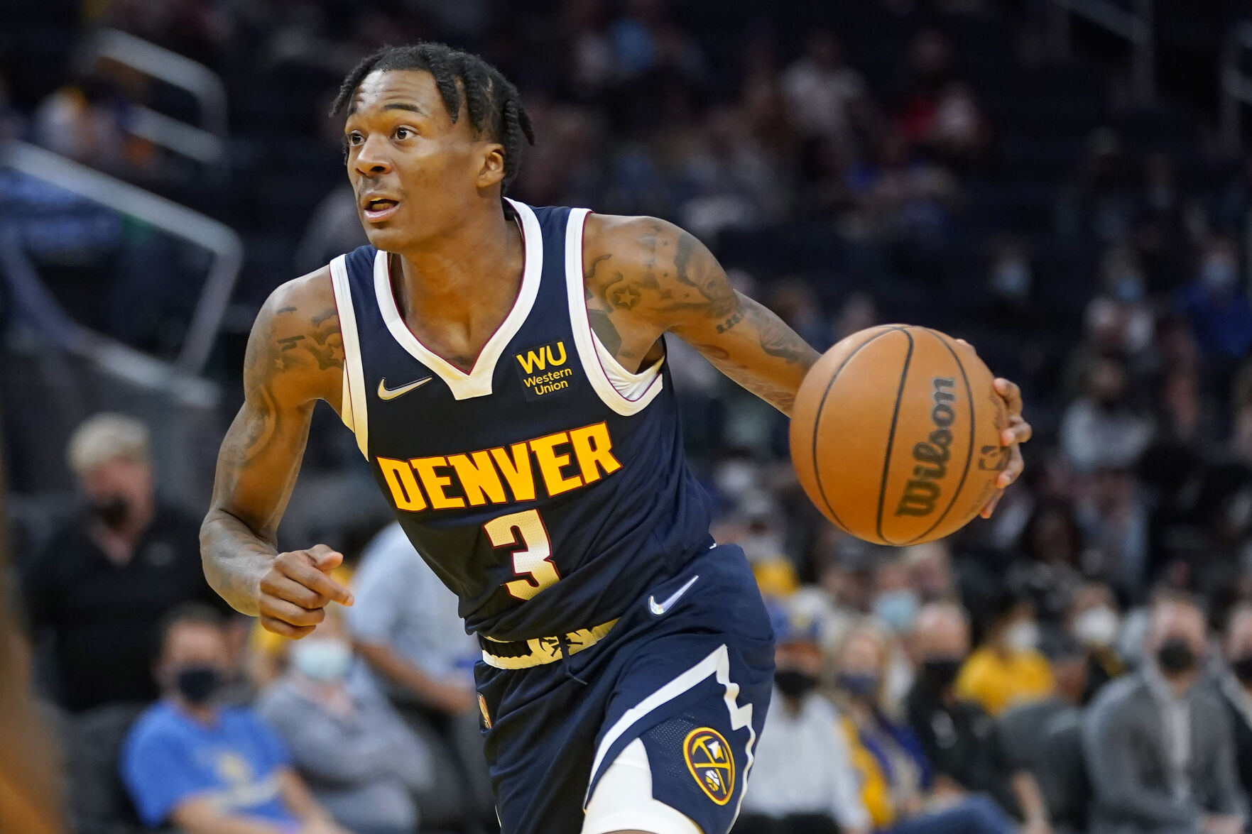 Nuggets guard Bones Hyland dribbles against the Golden State Warriors Oct. 6 in San Francisco. (the associated press)
