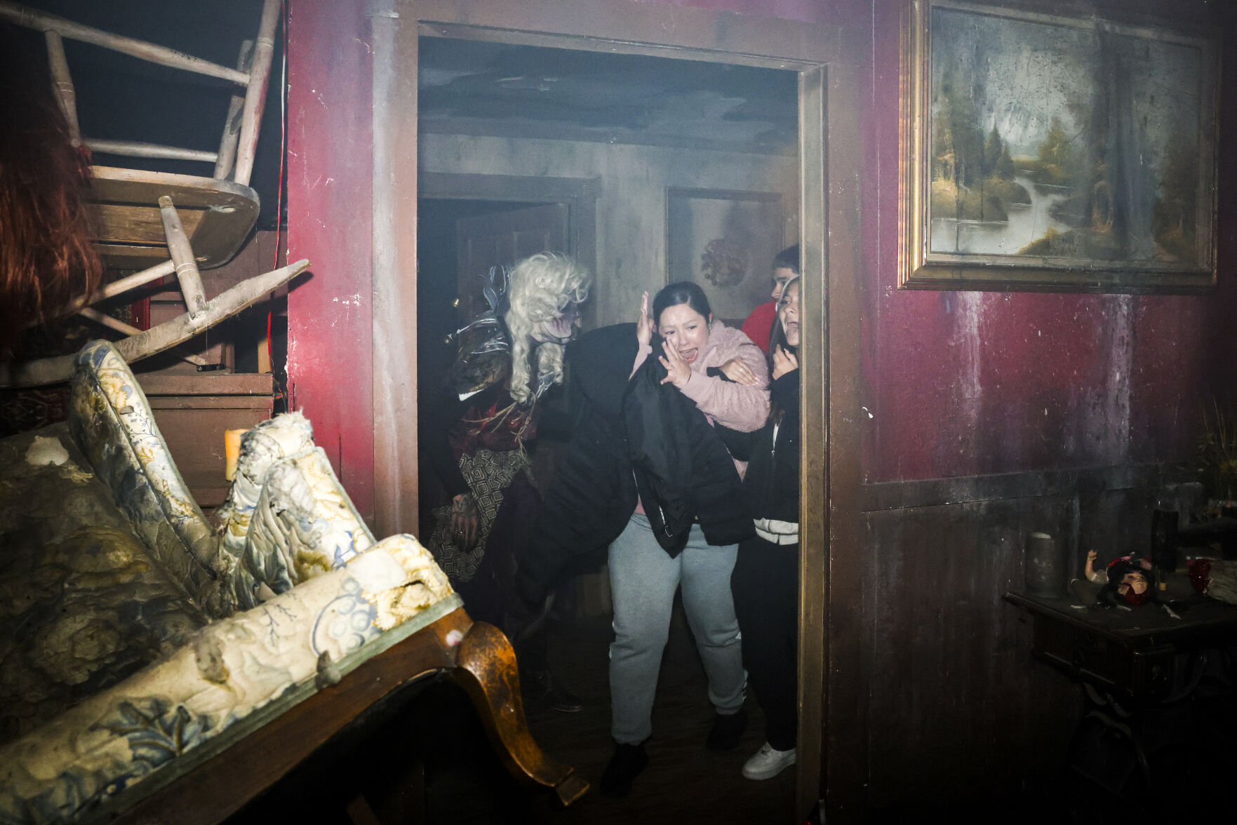 A 13th Floor Haunted House performer scares guests at the haunted house on Tuesday, Oct. 12, 2021 in Denver. (Michael Ciaglo/Special to The Denver Gazette)