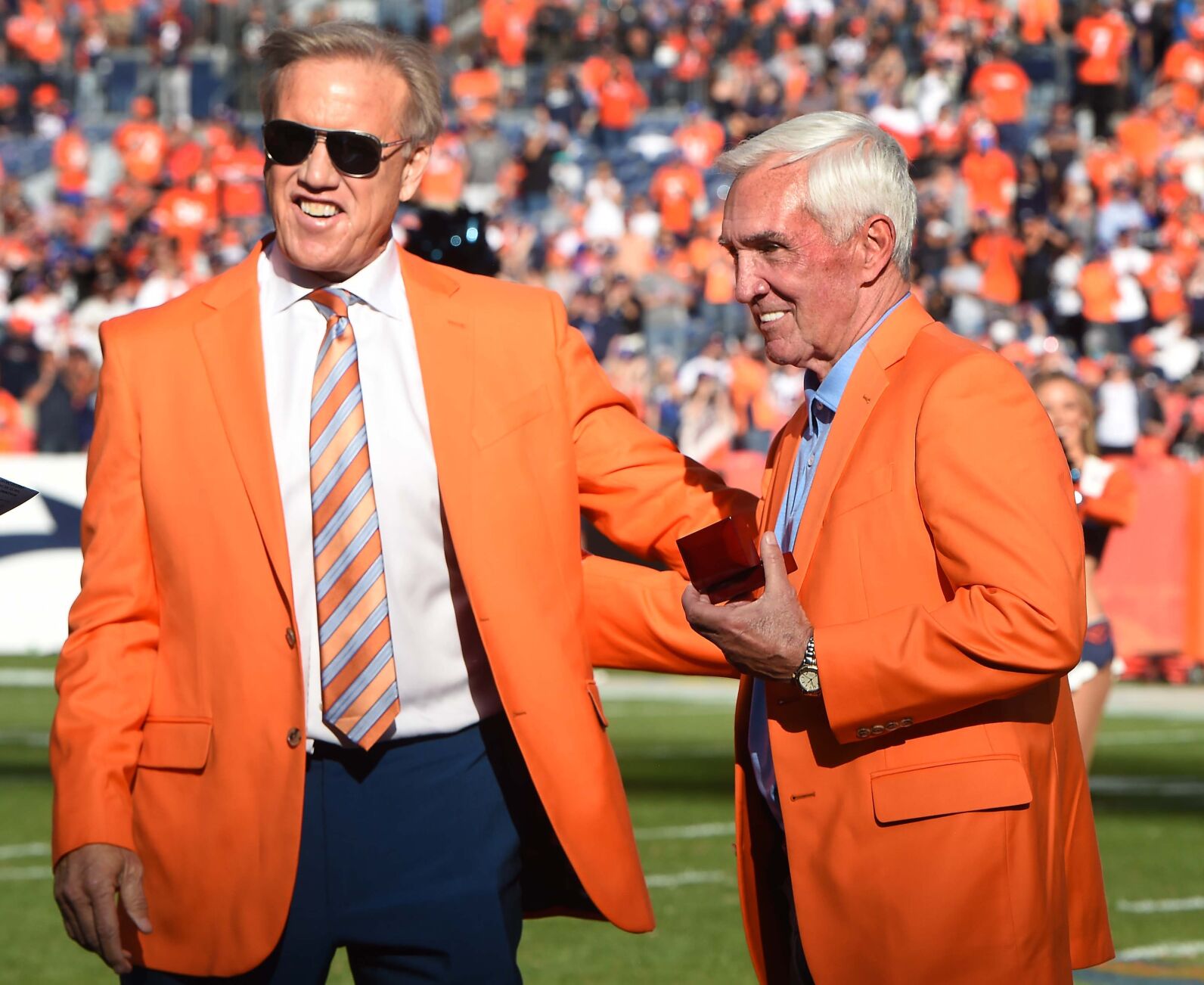 Many Broncos greats were in the house for Sunday’s game against the Raiders. Former Broncos Head Coach Mike Shanahan was added to the Ring of Fame. He was presented a commemorative ring by Broncos quarterback John Elway during a ceremony at halftime on Sunday, Oct. 17, 2021. Shanahan was the winningest coach in Bronco history and took them to two winning Superbowls. The Broncos were defeated 34-24. (Photo by Jerilee Bennett, The Gazette)