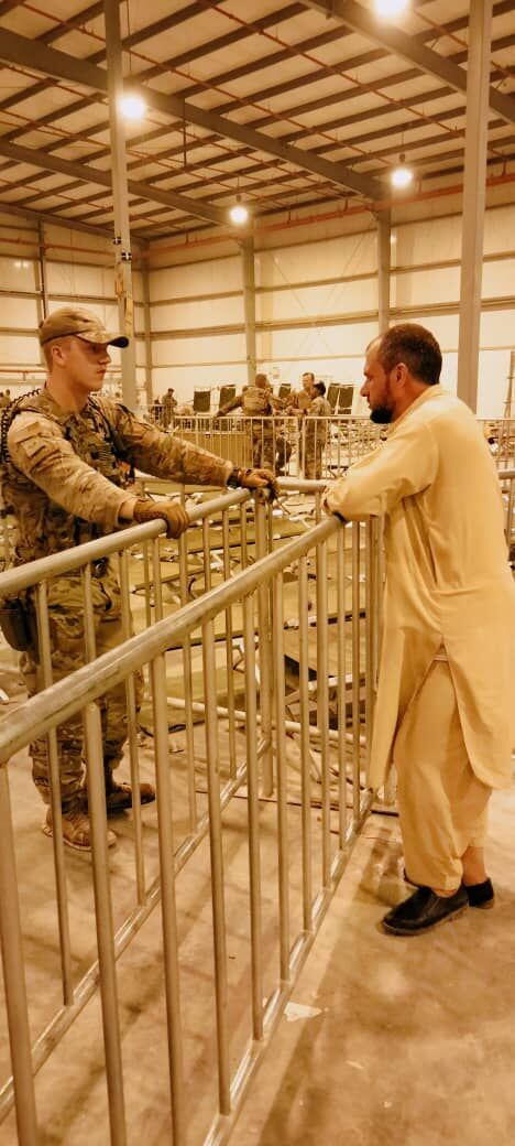 Lieutenant Chris Liggett in 2014 with his interpreter, 