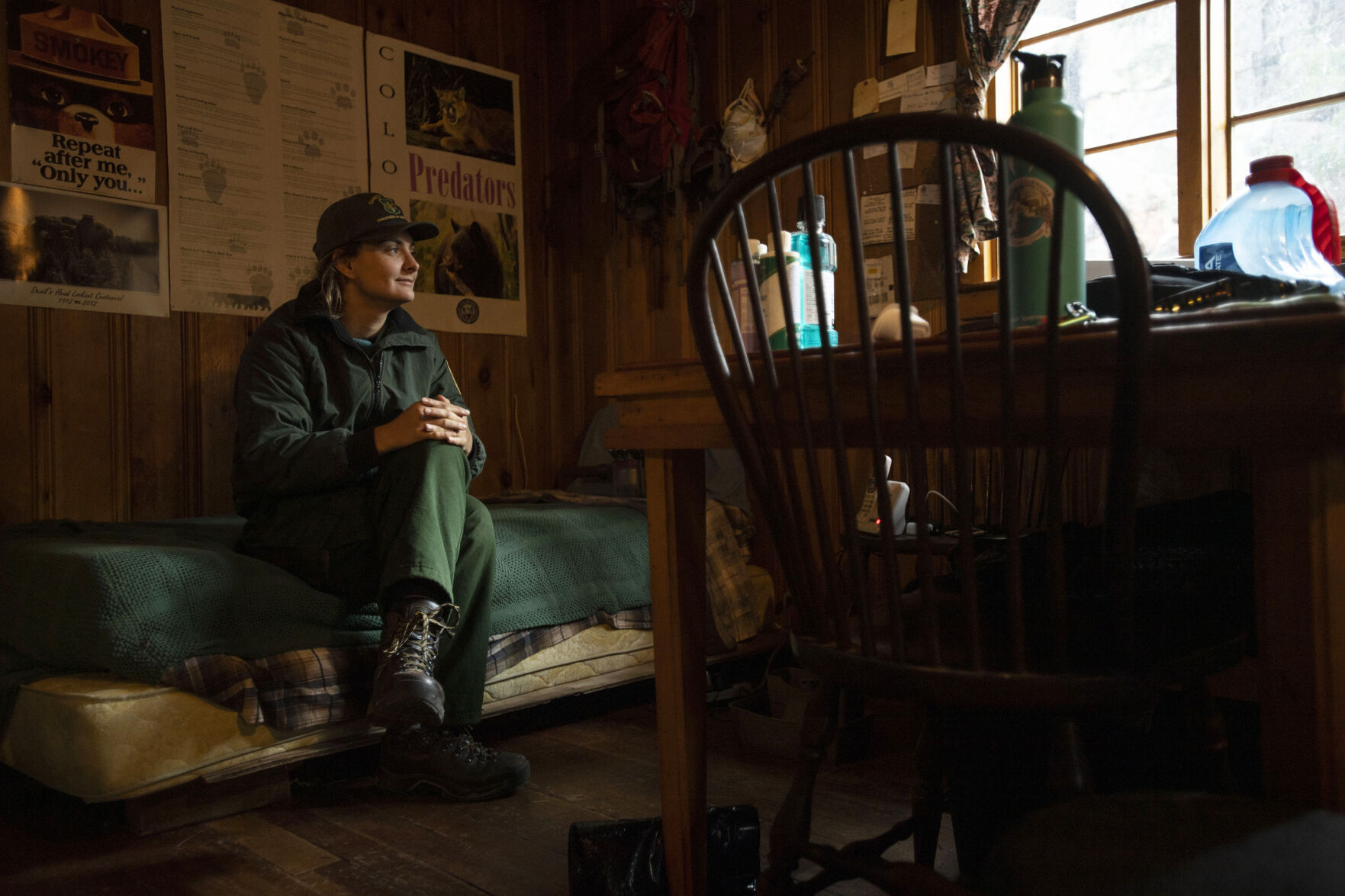 LEFT: Farinacci-Silfiessits inside her cabin located below the Devil’s Head Fire Lookout Tower outside of Sedalia in the Pike National Forest. (photos by Chancey Bush/ </p><p>The Gazette)” /><figcaption class=