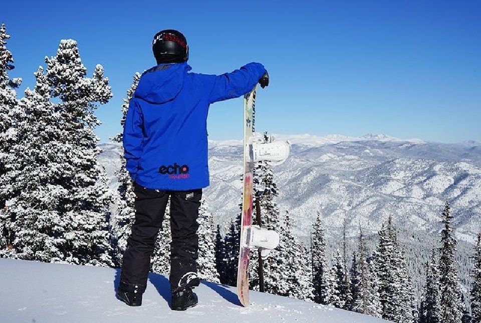 A snowboarder looks to the sweeping views from Echo Mountain, the ski area between Idaho Springs and Evergreen. Courtesy photo