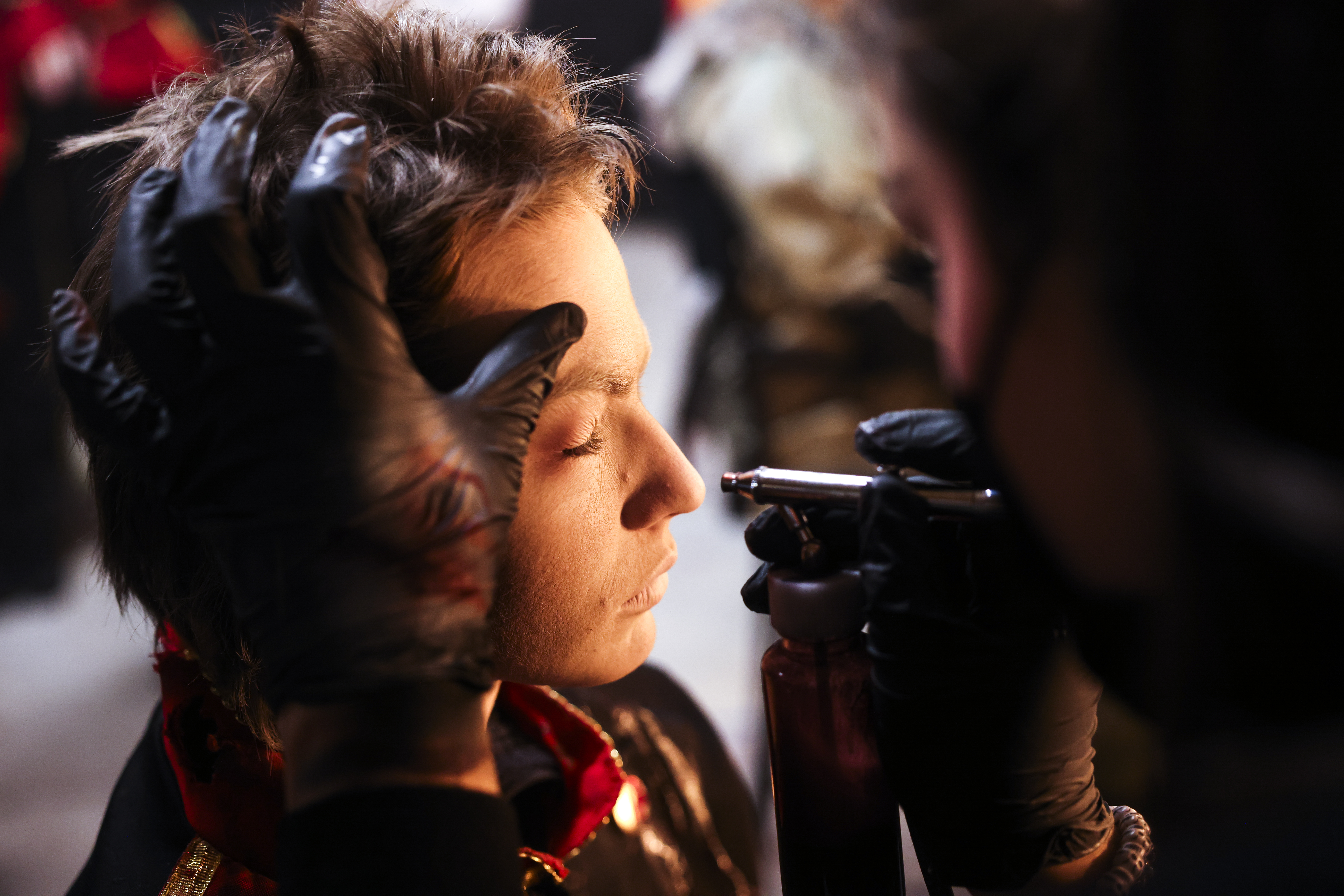 A performer at 13th Floor Haunted House gets their makeup done before guests arrive at the haunted house on Tuesday, Oct. 12, 2021 in Denver. (Michael Ciaglo/Special to The Denver Gazette)