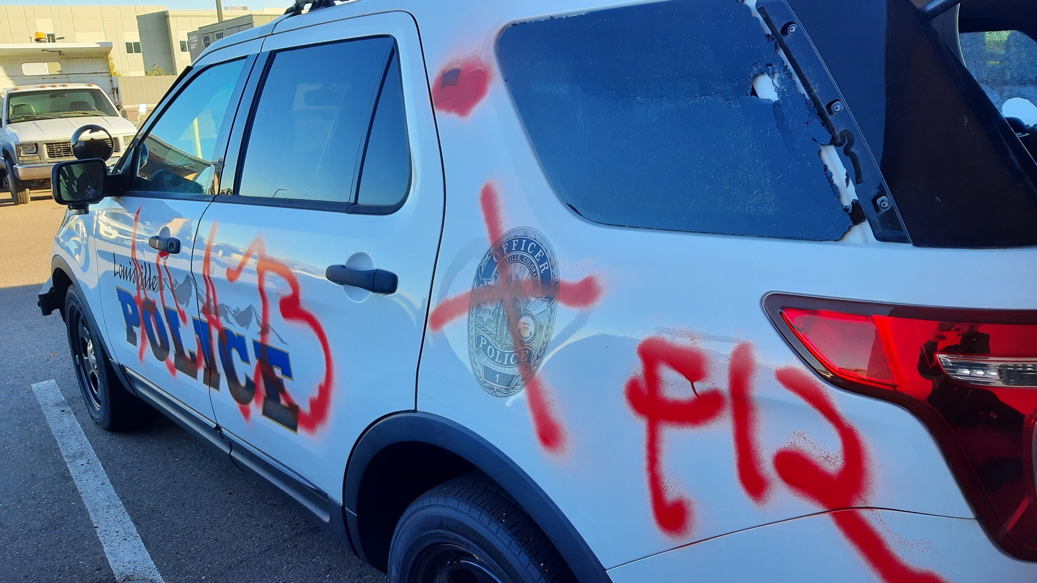 A Louisville Police Department SUV was vandalized overnight with anti-police slogans, according to the department. (Courtesy of the Louisville Police Department)