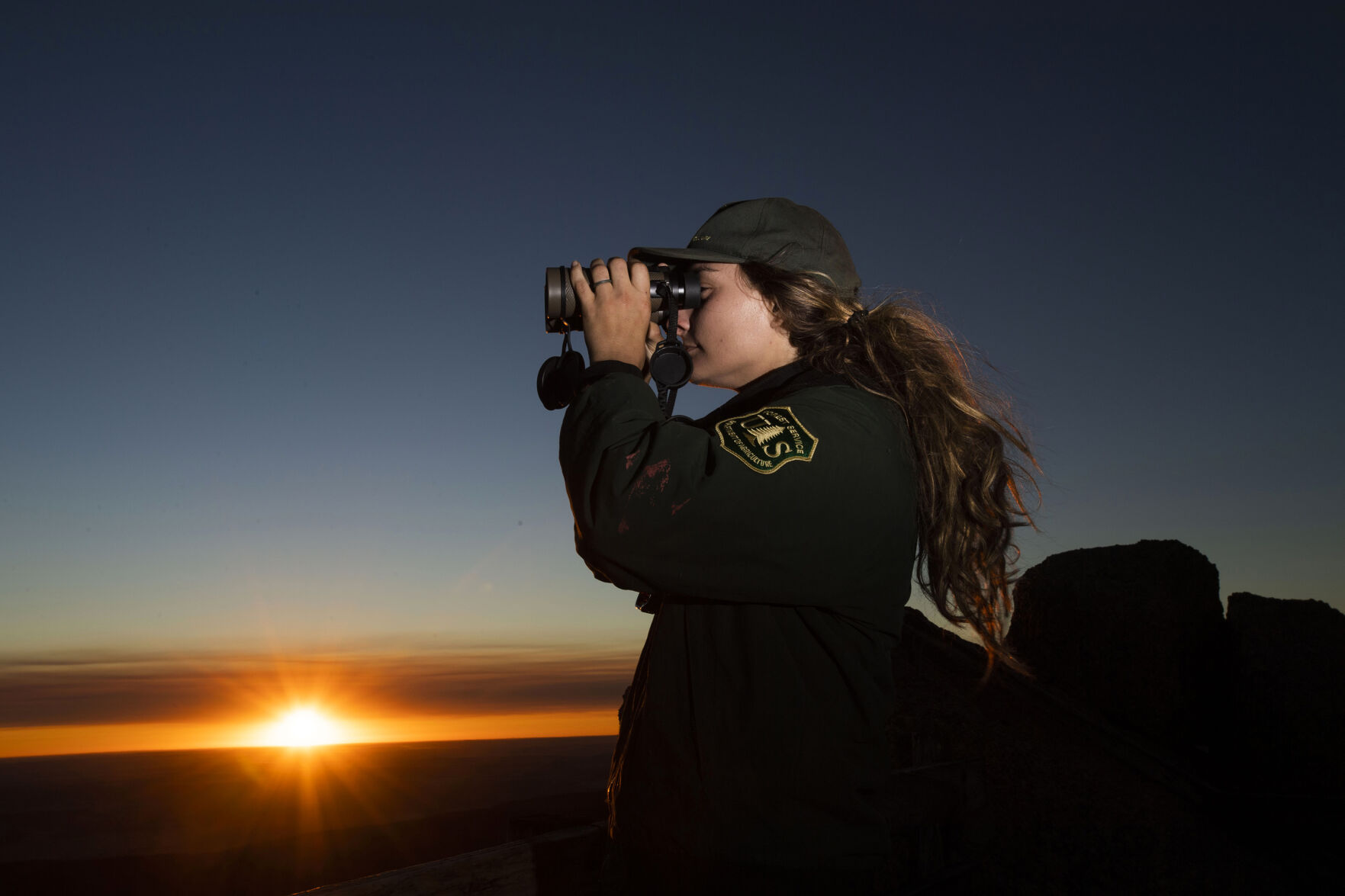 ABOVE: Ashley Farinacci-Silfies, 27, is the fire lookout at the Devil’s Head Fire Lookout Tower outside of Sedalia in the Pike National Forest. The lookout is the only one of four original Front Range fire lookout towers still in operation. (photos by Chancey Bush, The Gazette)