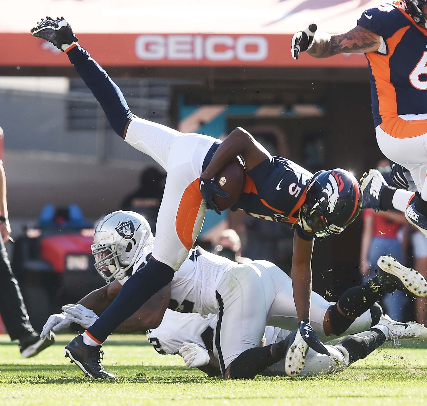 Broncos quarterback Teddy Bridgewater flies for a first down in the second quarter of a game at Empower Field at Mile High Stadium on Sunday, Oct. 17, 2021. The Broncos were defeated 34-24. (Photo by Jerilee Bennett, The Gazette)