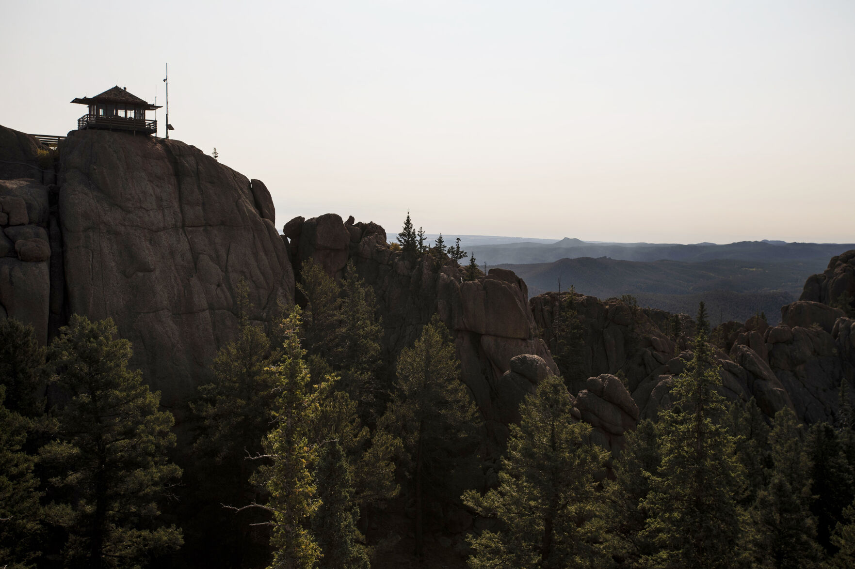 Ashley Farinacci-Silfies, 27, is the fire lookout at the Devil’s Head Fire Lookout Tower outside of Sedalia in the Pike National Forest. The lookout stands at 9,748 feet in elevation and is the last of four original Front Range fire lookout towers still in operation. Farinacci-Silfies just finished up her second season after taking over the duty from Bill Ellis, who finished his 35th season and retired at the age of 87. (Chancey Bush/The Gazette)
