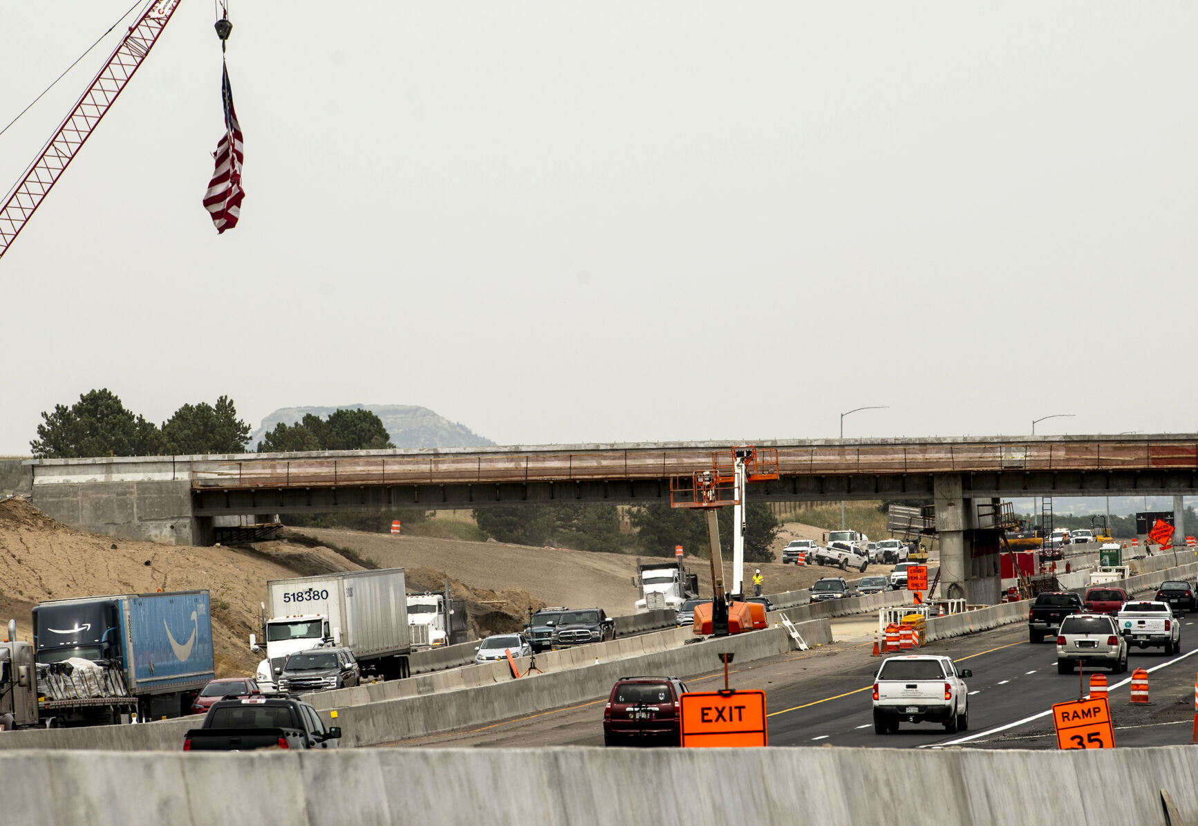 Crews work on a new bridge on Interstate 25 at County Line Road near Monument in September 2021 as part of ongoing construction in the Interstate 25 South “gap” project, widening lanes along the highway from Monument to Castle Rock. The new bridge is 95% complete, state transportation officials said. (Chancey Bush, The Gazette)