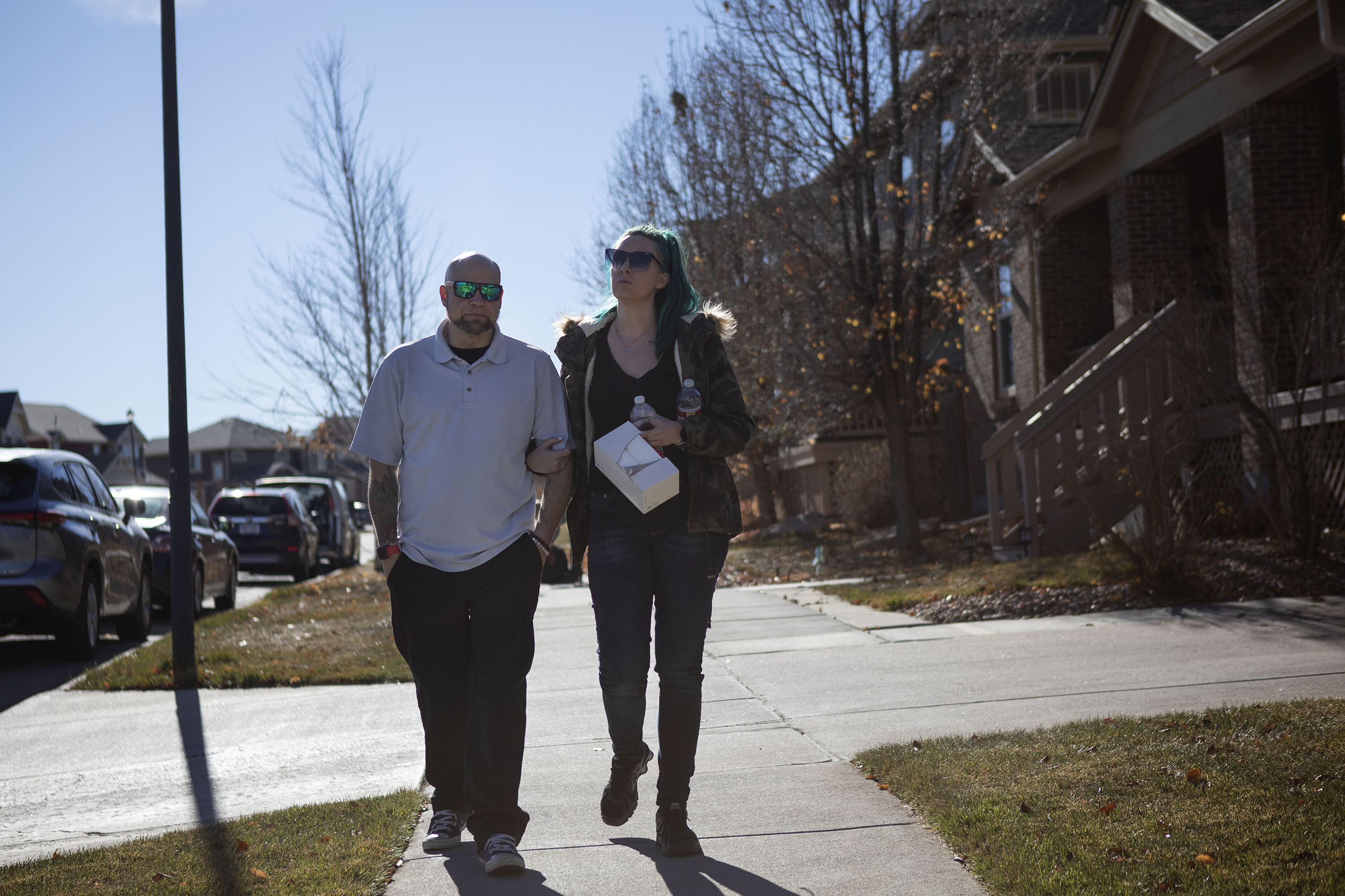 Todd Blitstein and Cayla Blitstein walk down the sidewalk where a few houses up the street their 17-year-old son Peyton Blitstein was shot and killed during an altercation last Wednesday, as seen on Tuesday, Nov. 30, 2021, in Aurora, Colo. (Timothy Hurst/The Gazette) (Timothy Hurst)