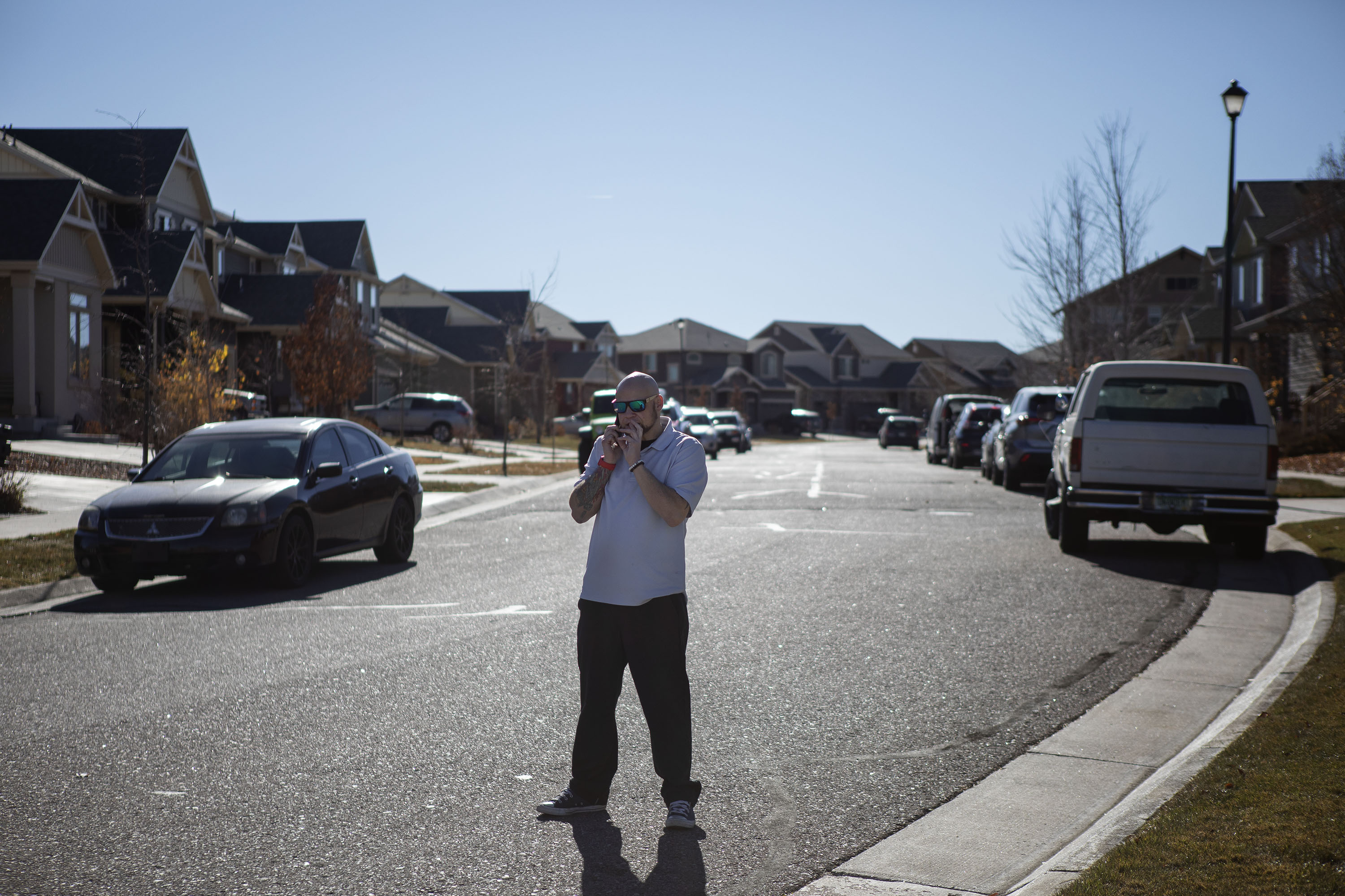 Todd Blitstein, the father of Peyton Blitstein, the 17-year-old who was shot and killed during an altercation last Wednesday, talks on the phone at the entrance of the street where his son was shot on Tuesday, Nov. 30, 2021, in Aurora, Colo. (Timothy Hurst/The Gazette) (Timothy Hurst)
