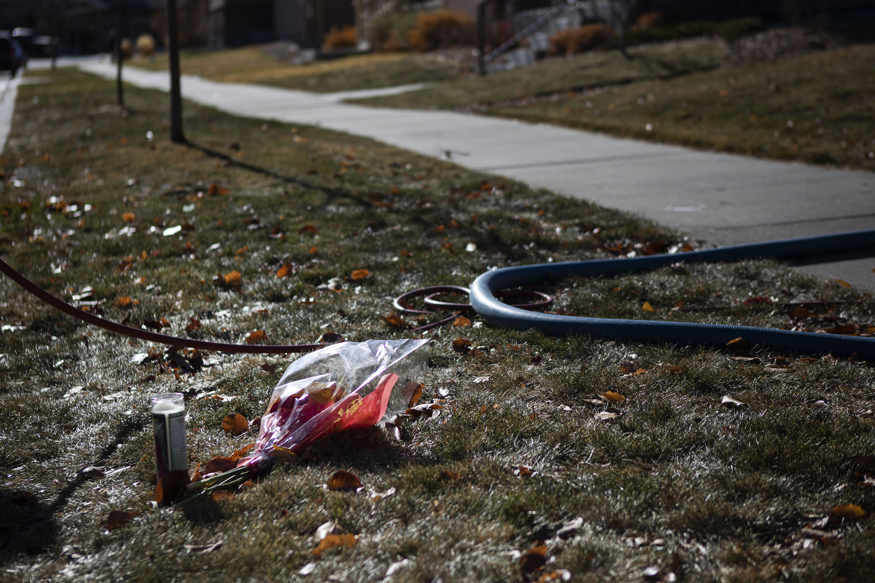 Flowers are left on the grass near where Peyton Blitstein was shot and killed during an altercation last Wednesday, as seen on Tuesday, Nov. 30, 2021, in Aurora, Colo. (Timothy Hurst/The Gazette) (Timothy Hurst)