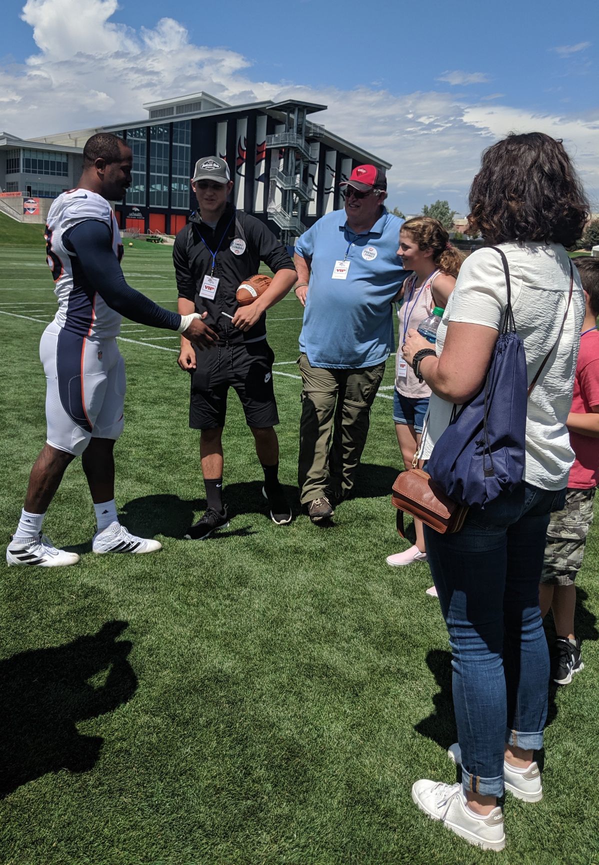Broncos star Von Miller greets the family of late Green Beret James “Ryan” Sartor at UCHealth Training Center in this undated file photo. Family members included Stryder Sartor, David Unger, Grace Sartor, Garrett Sartor and Deanna Sartor. (Paul Klee, The Gazette)