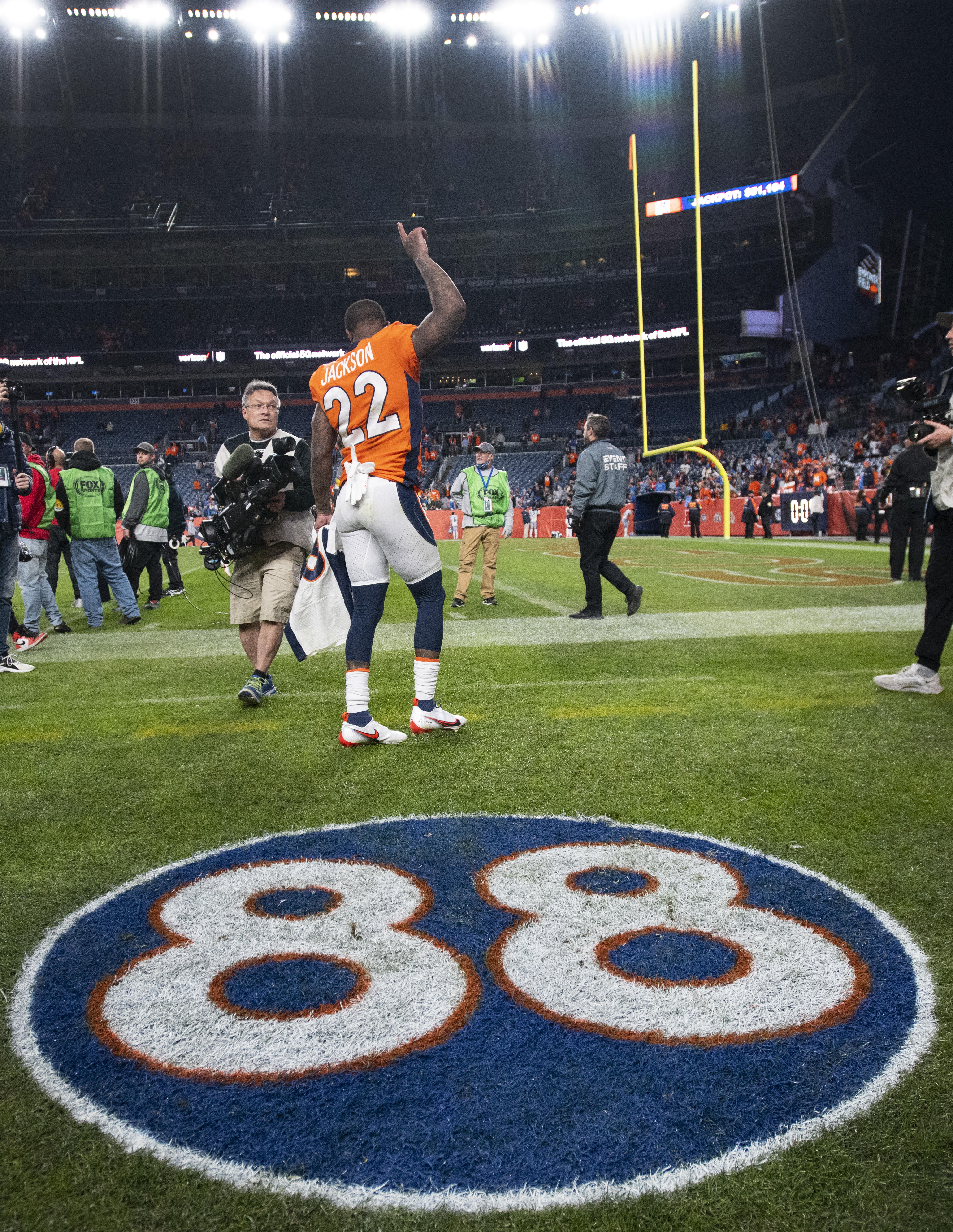 Denver Broncos safety Kareem Jackson (22) points toward the sky after paying tribute to former Broncos wide receiver Demaryius Thomas (88) who died Thursday after the Broncos’ 38-10 over the Detroit Lions Sunday, Dec. 12, 2021, at Empower Field at Mile High in Denver. (The Gazette, Christian Murdock) (Christian Murdock/The Gazette)