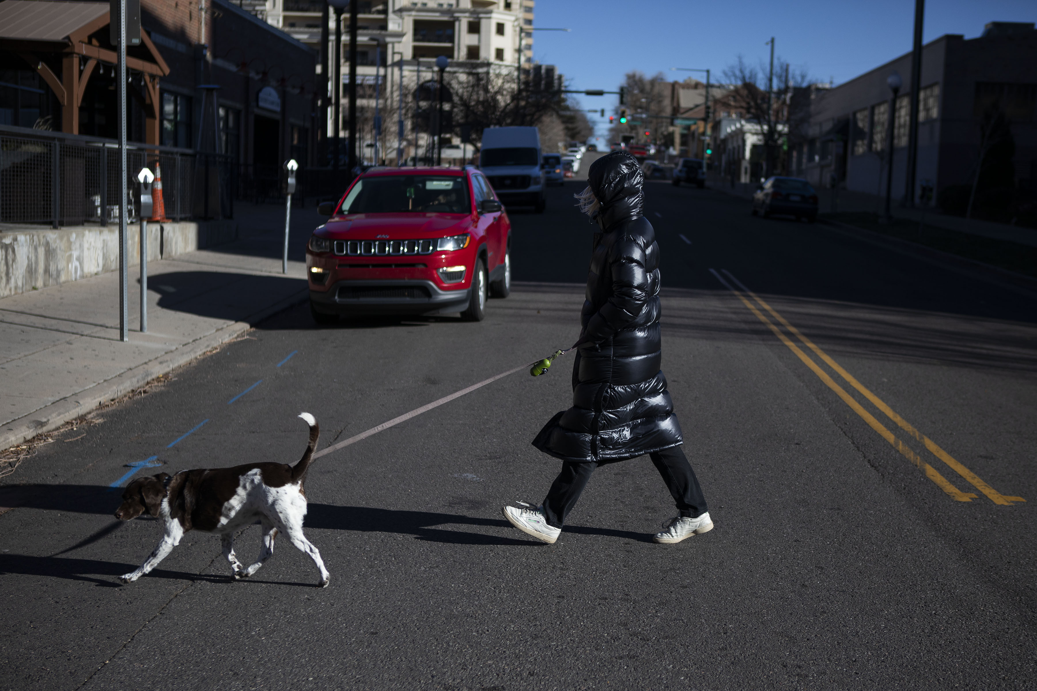 Mary Heiman and her five-year old dog Zoe brave the high winds to o for a walk on Wednesday, Dec. 15, 2021, in Denver, Colo. (Timothy Hurst/The Gazette) (Timothy Hurst)