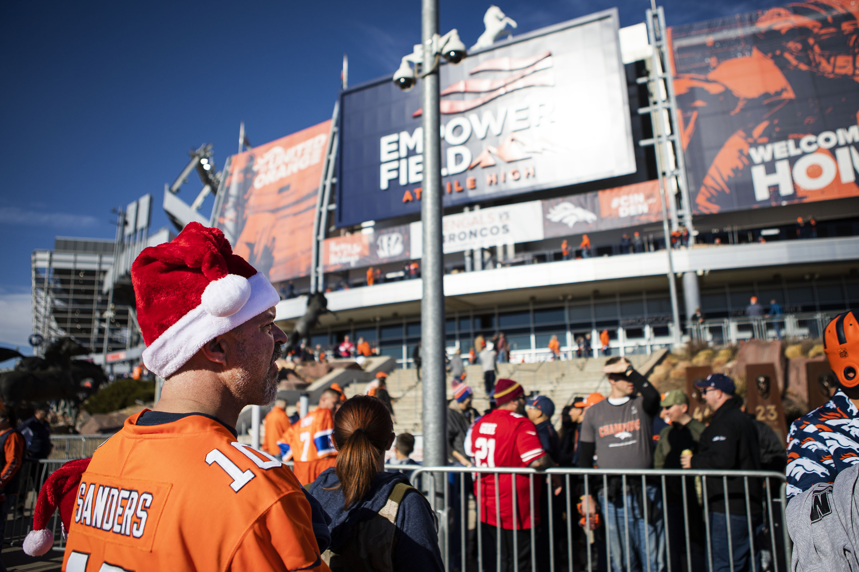 Aaron Bevington, from Loveland, wears his Santa Clause hat while waiting to get into the stadium before a Denver Broncos and Cincinnati Bengals game on Sunday, Dec. 19, 2021, at Empower Field at Mile High in Denver, Colo. (Timothy Hurst/The Gazette) (Timothy Hurst)