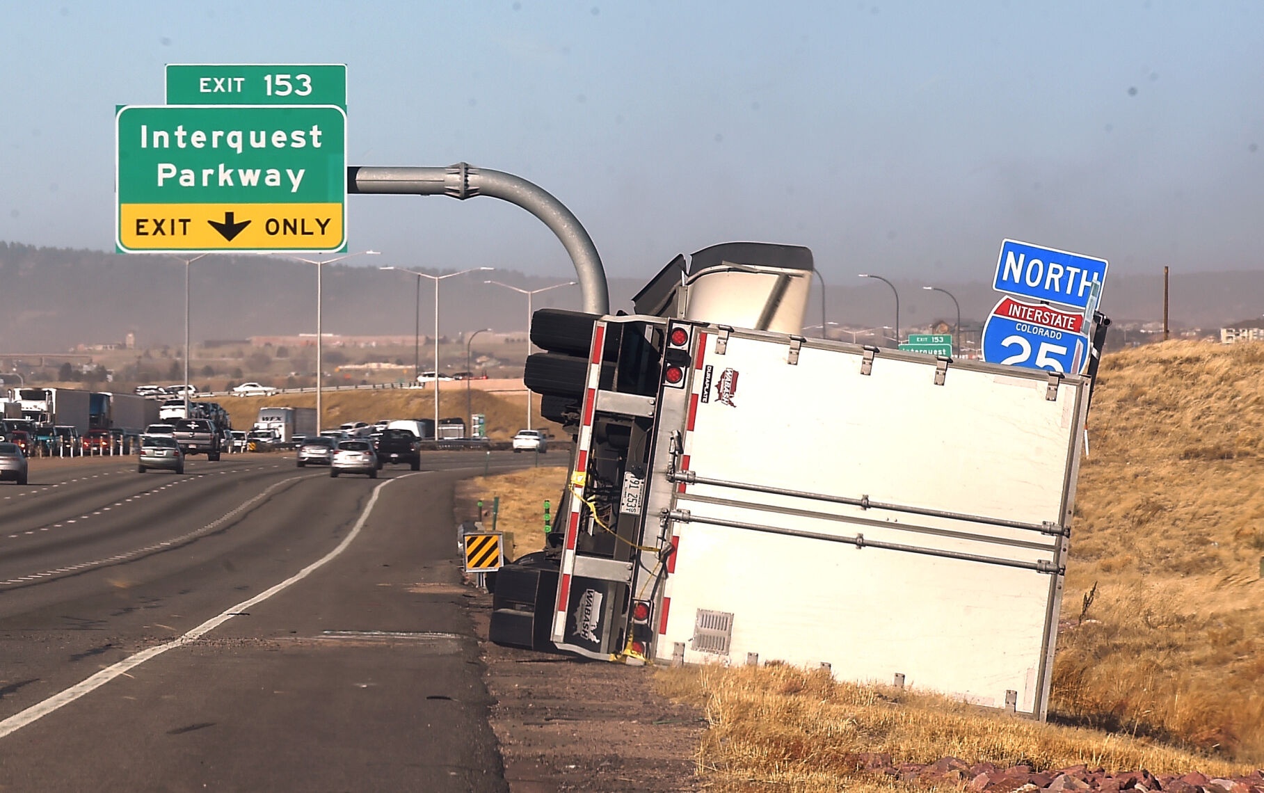 High winds toppled a semi-truck on I-25 in the northbound lane on Wednesday, Dec. 15, 2021. There were over a dozen semi-trucks that were toppled on I-25 in the Pikes Peak region. (Photo by Jerilee Bennett, The Gazette) (Jerilee Bennett)