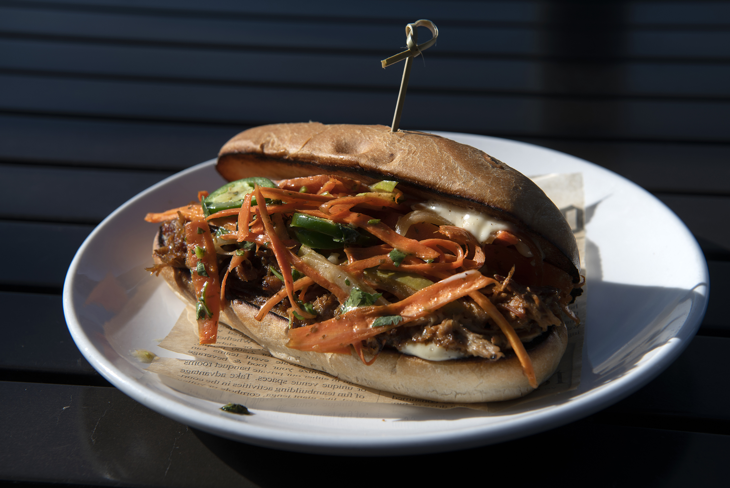 The bahn mi pork sandwich at ViewHouse is a baguette bursting with sliced roasted pork, thinly sliced pickled carrots and red onion, red pepper, jalapeno peppers and green apples. (Jeff Kearney, special to the gazette)