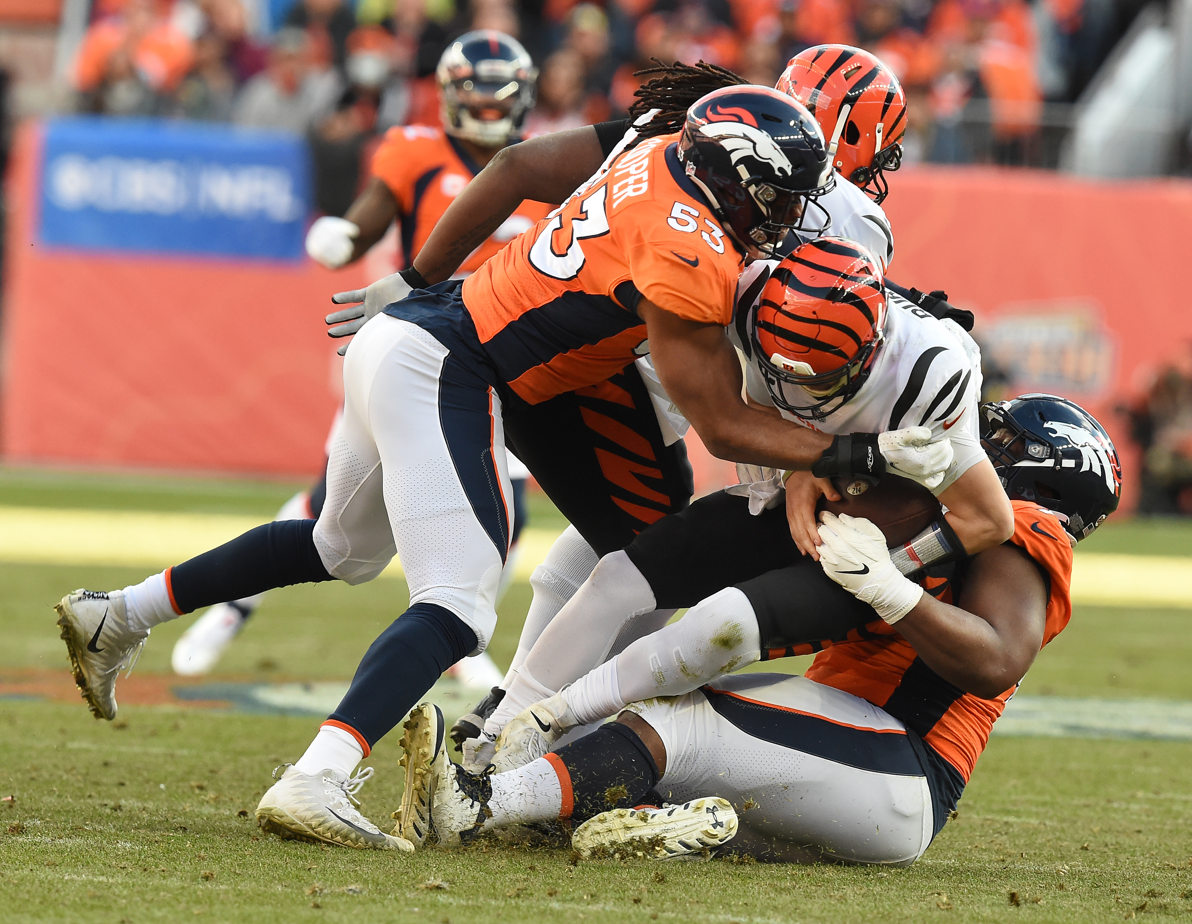 Broncos linebacker Jonathan Cooper and defensive end Shelby Harris sack Bengals quarterback Joe Burrow in the second quarter. The Broncos played the Bengals at Mile High Stadium on Sunday, Dec. 19, 2021. The Broncos lost the game 15-10.(Photo by Jerilee Bennett, The Gazette) (Jerilee Bennett)