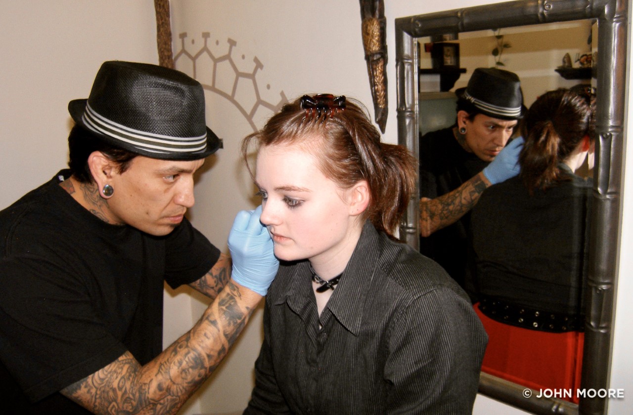 Jamie Moore-McNear was 17 when her mother gave permission for her to get three piercings - two ears and an eyebrow - from artist Jimmy Maldonado at Sol Tribe Tattoo and Body Piercing on Jan. 31, 2011. (John Moore)