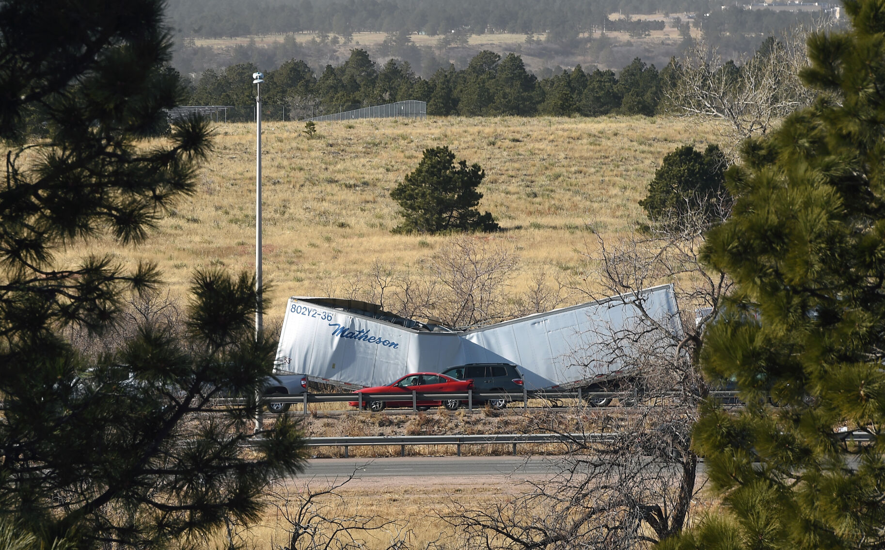 High winds toppled a semi-truck on I-25 in the southbound lane on Wednesday, Dec. 15, 2021. There were over a dozen semi-trucks that were toppled on I-25 in the Pikes Peak region. (Photo by Jerilee Bennett, The Gazette) (Jerilee Bennett)