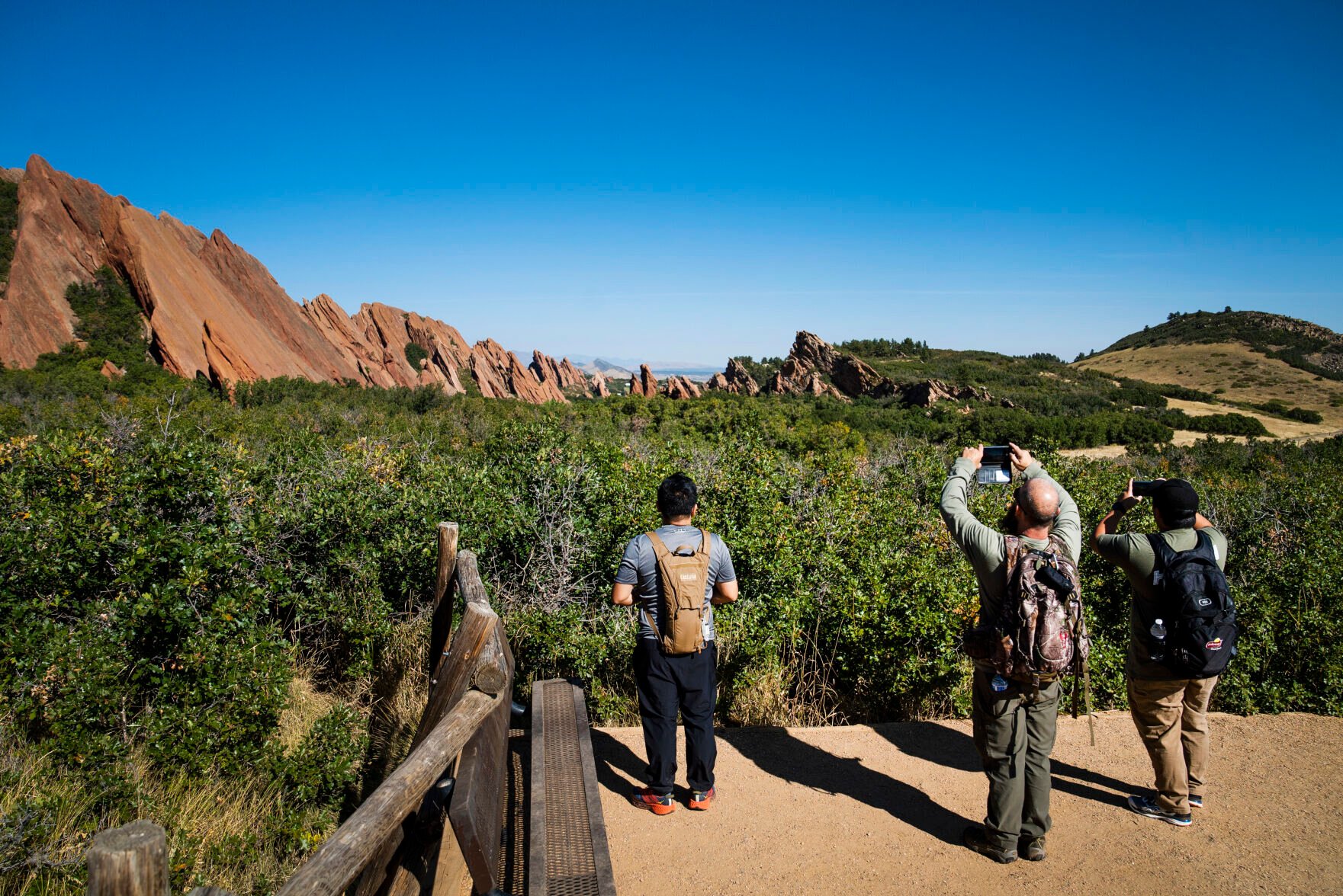 Visitors take photos of the rock formations from the Fountain Valley Overlook at Roxborough State Park in Littleton. (The Gazette file)